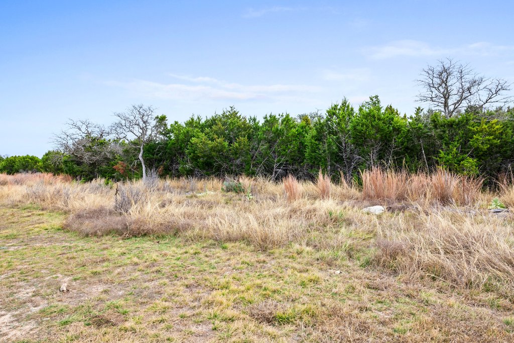 4718 Private Road Kempner, TX 76539 - Photo 21 of 28 a backyard of a house with lots of green space and lake view