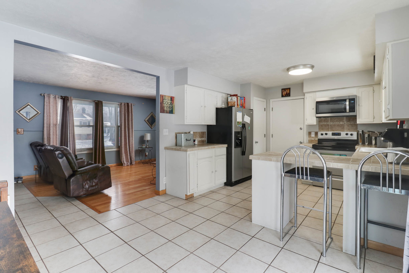 203 Edwards Drive Normal, IL 61761 - Photo 11 of 28 a kitchen with stainless steel appliances a refrigerator and a stove top oven