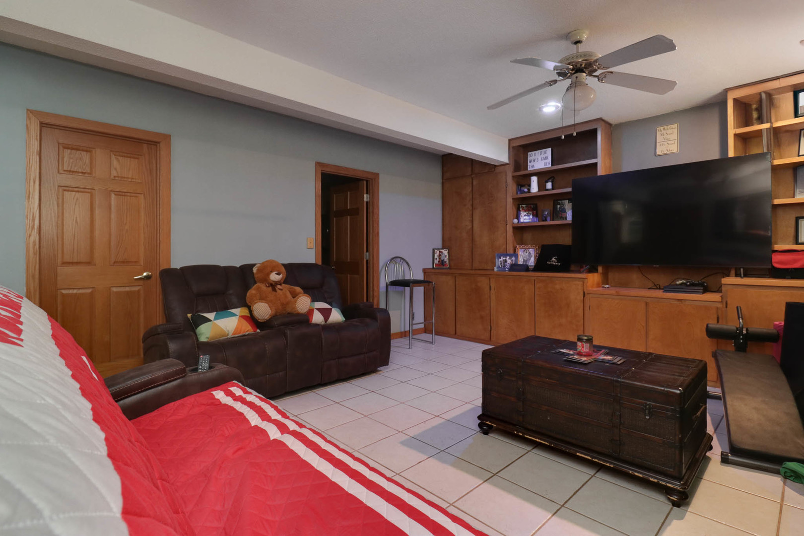203 Edwards Drive Normal, IL 61761 - Photo 13 of 28 a living room with furniture and a flat screen tv