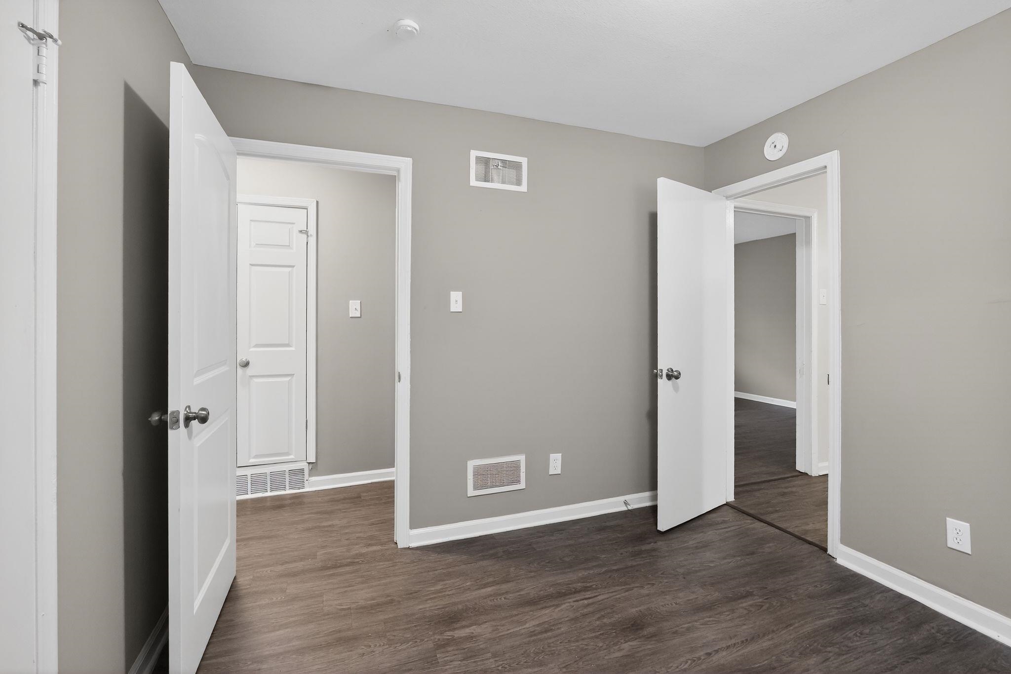 3603 England Street Memphis, TN 38127 - Photo 26 of 36 Unfurnished bedroom with dark wood-style flooring