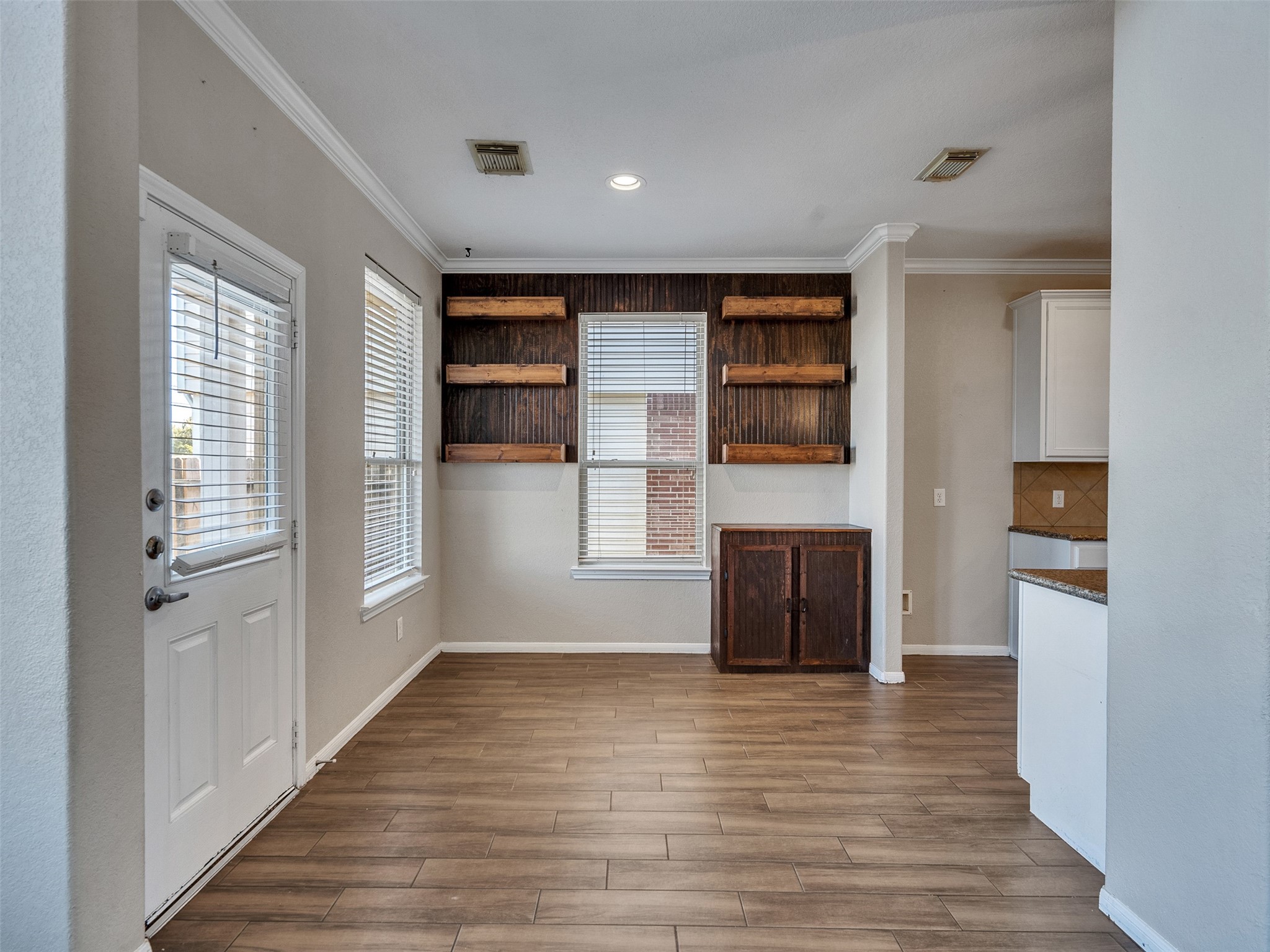 6014 Flagg Ranch Court Spring, TX 77388 - Photo 11 of 37 an empty room with wooden floor and windows