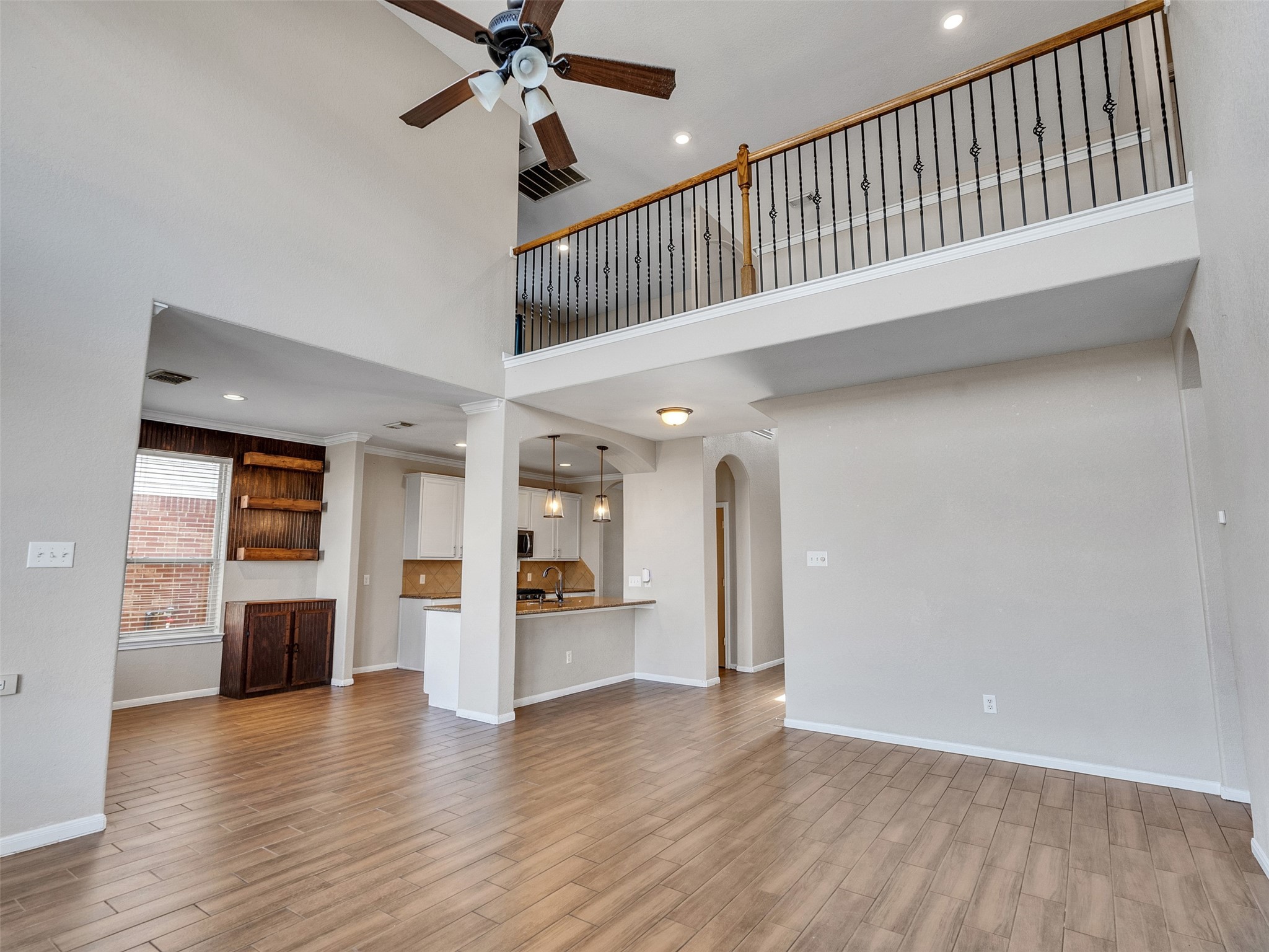 6014 Flagg Ranch Court Spring, TX 77388 - Photo 12 of 37 a view of a hallway with wooden floor and a kitchen