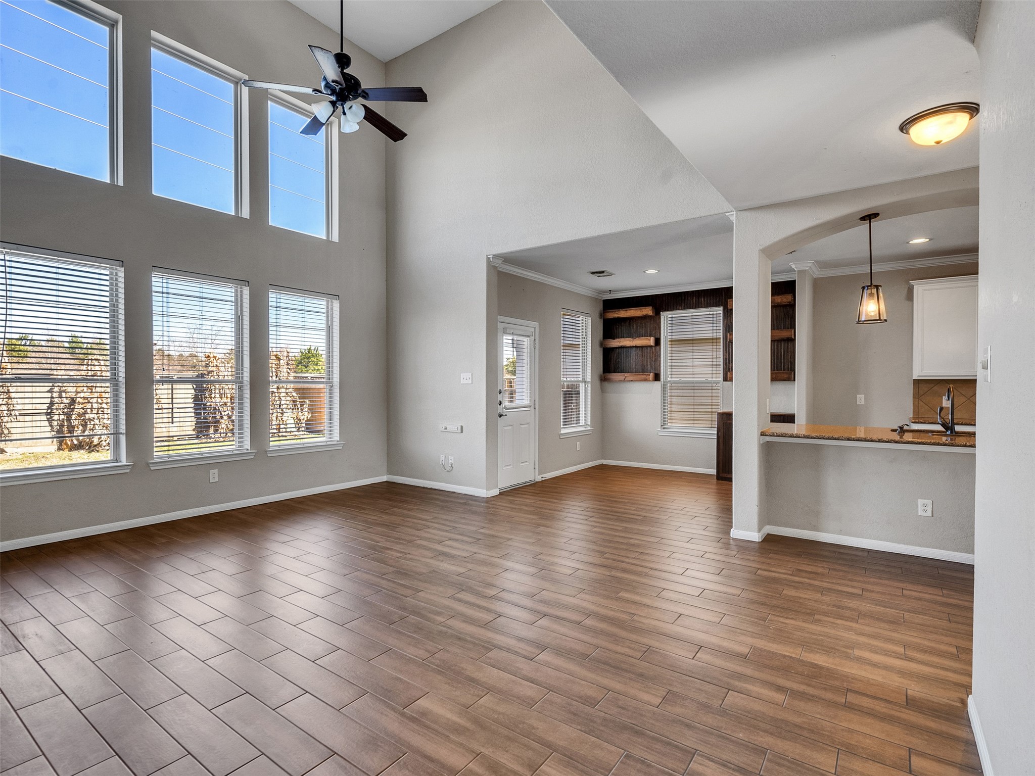 6014 Flagg Ranch Court Spring, TX 77388 - Photo 13 of 37 a view of an empty room with window and wooden floor