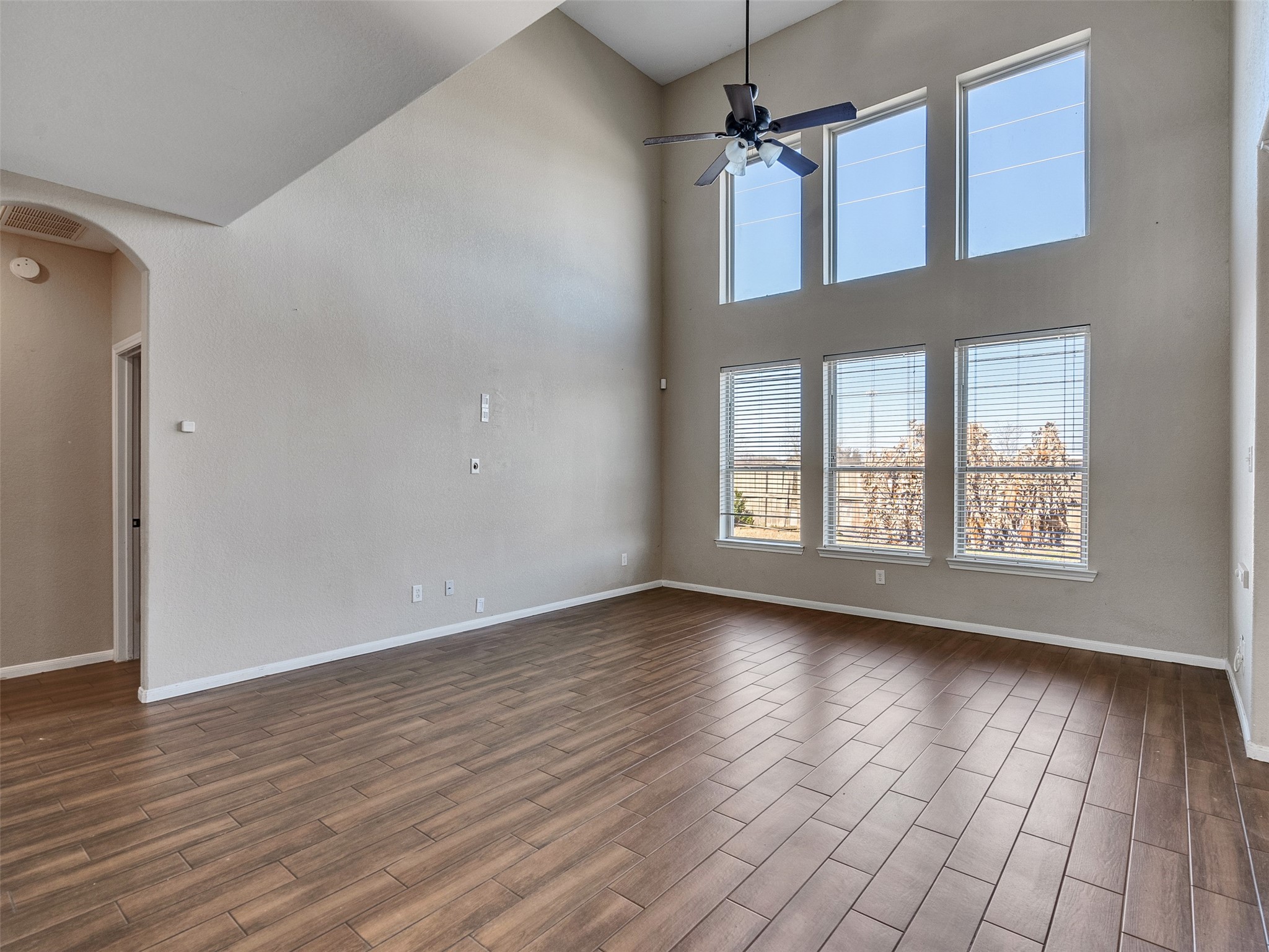 6014 Flagg Ranch Court Spring, TX 77388 - Photo 15 of 37 a view of an empty room with wooden floor and a window