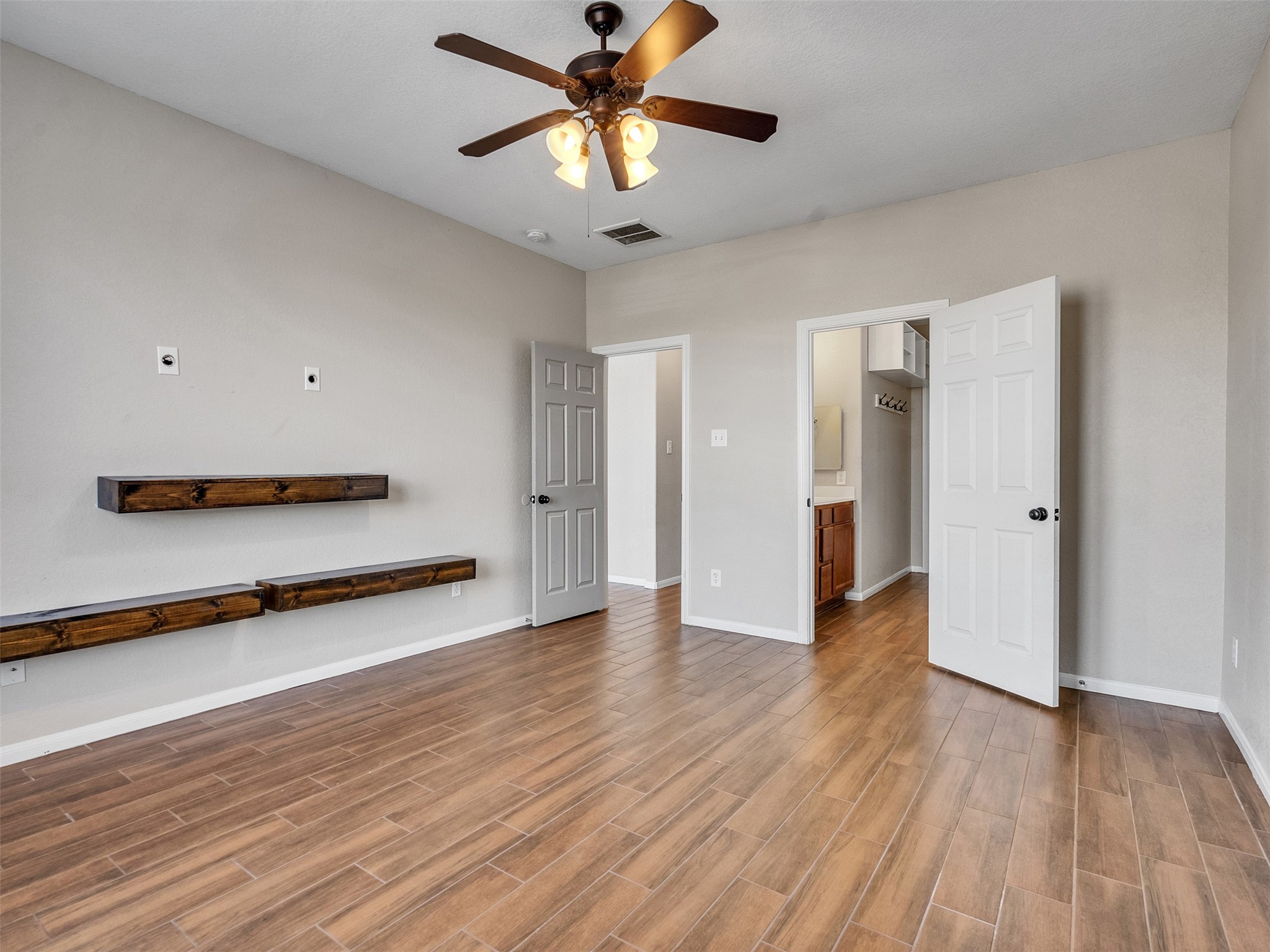 6014 Flagg Ranch Court Spring, TX 77388 - Photo 16 of 37 a view of a room with wooden floor and a ceiling fan