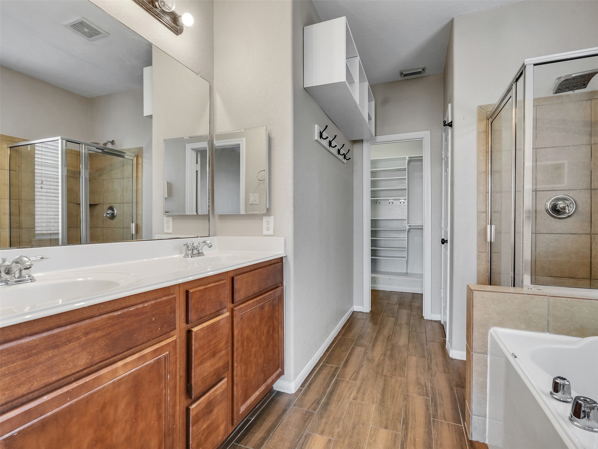 6014 Flagg Ranch Court Spring, TX 77388 - Photo 18 of 37 a spacious bathroom with a shower sink and mirror