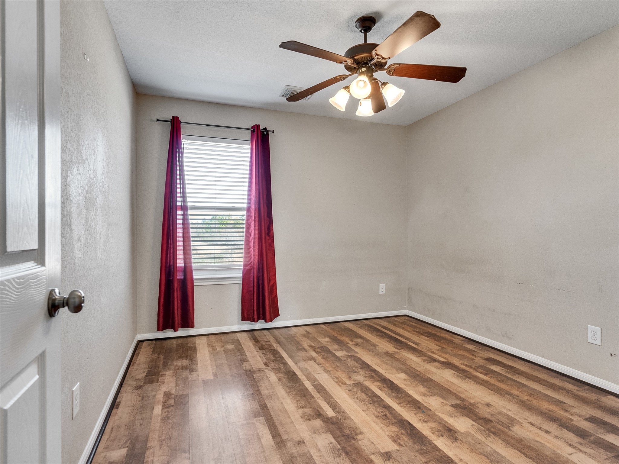 6014 Flagg Ranch Court Spring, TX 77388 - Photo 23 of 37 a view of a room with a large window and ceiling fan