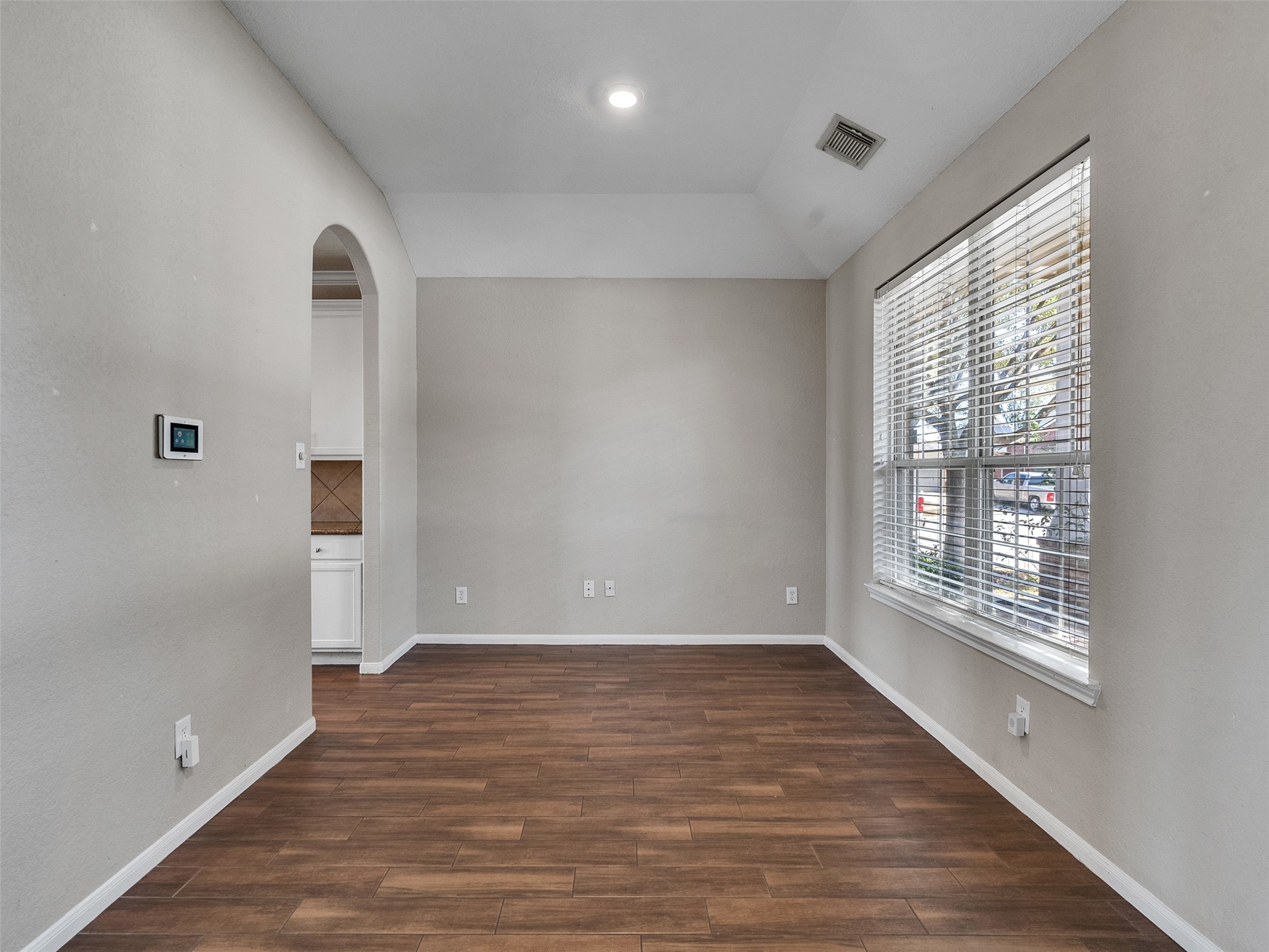 6014 Flagg Ranch Court Spring, TX 77388 - Photo 27 of 37 a view of an empty room with wooden floor and a window