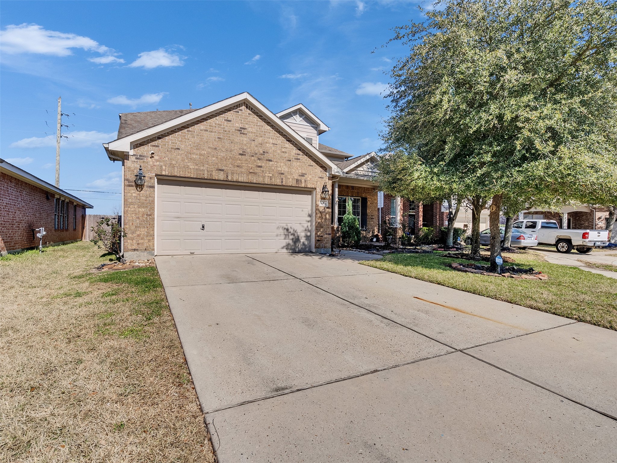 6014 Flagg Ranch Court Spring, TX 77388 - Photo 3 of 37 a front view of a house with a yard and garage