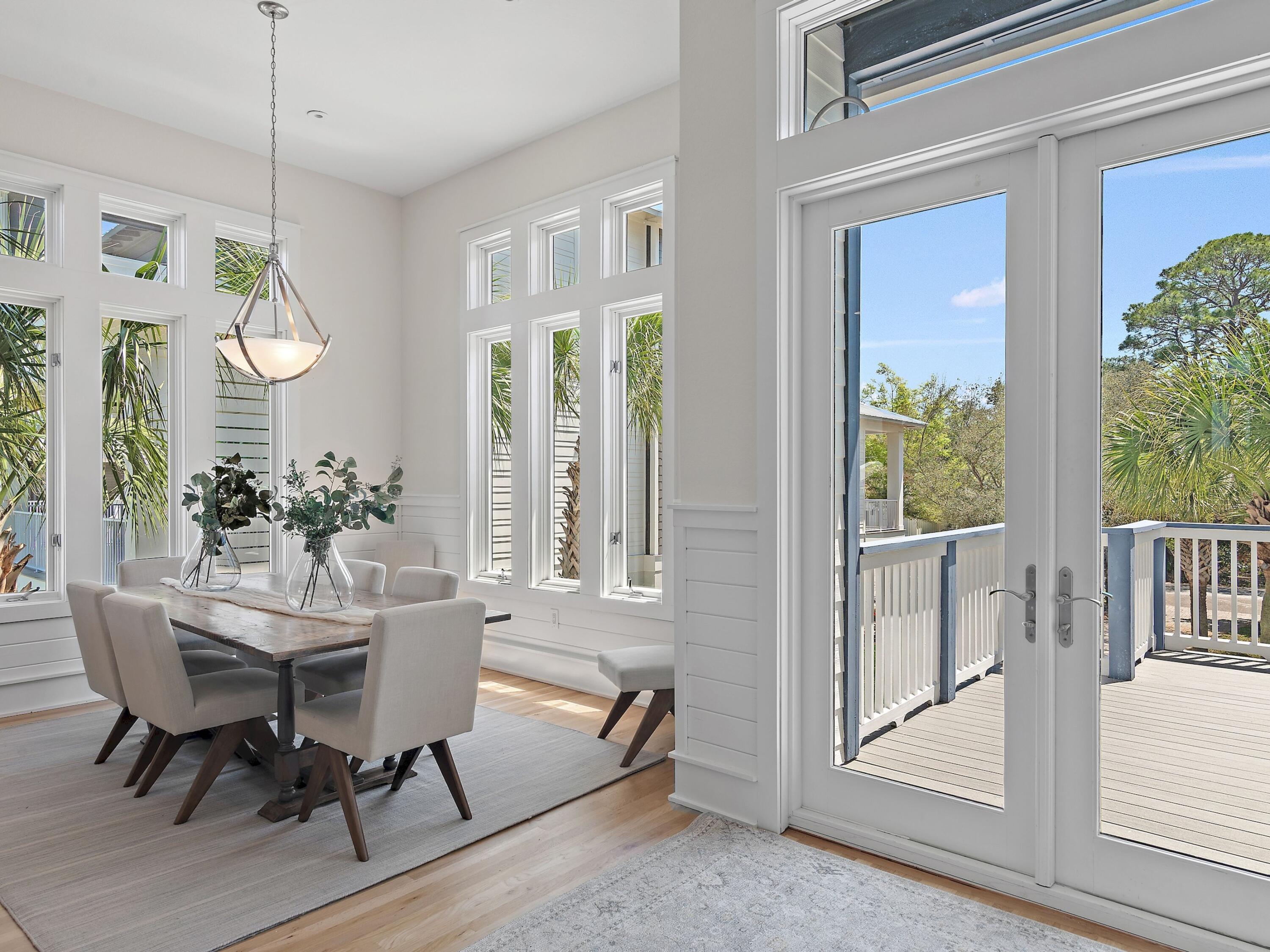 182 My Way Santa Rosa Beach, FL 32459 - Photo 15 of 39 a view of a dining room with furniture window and wooden floor