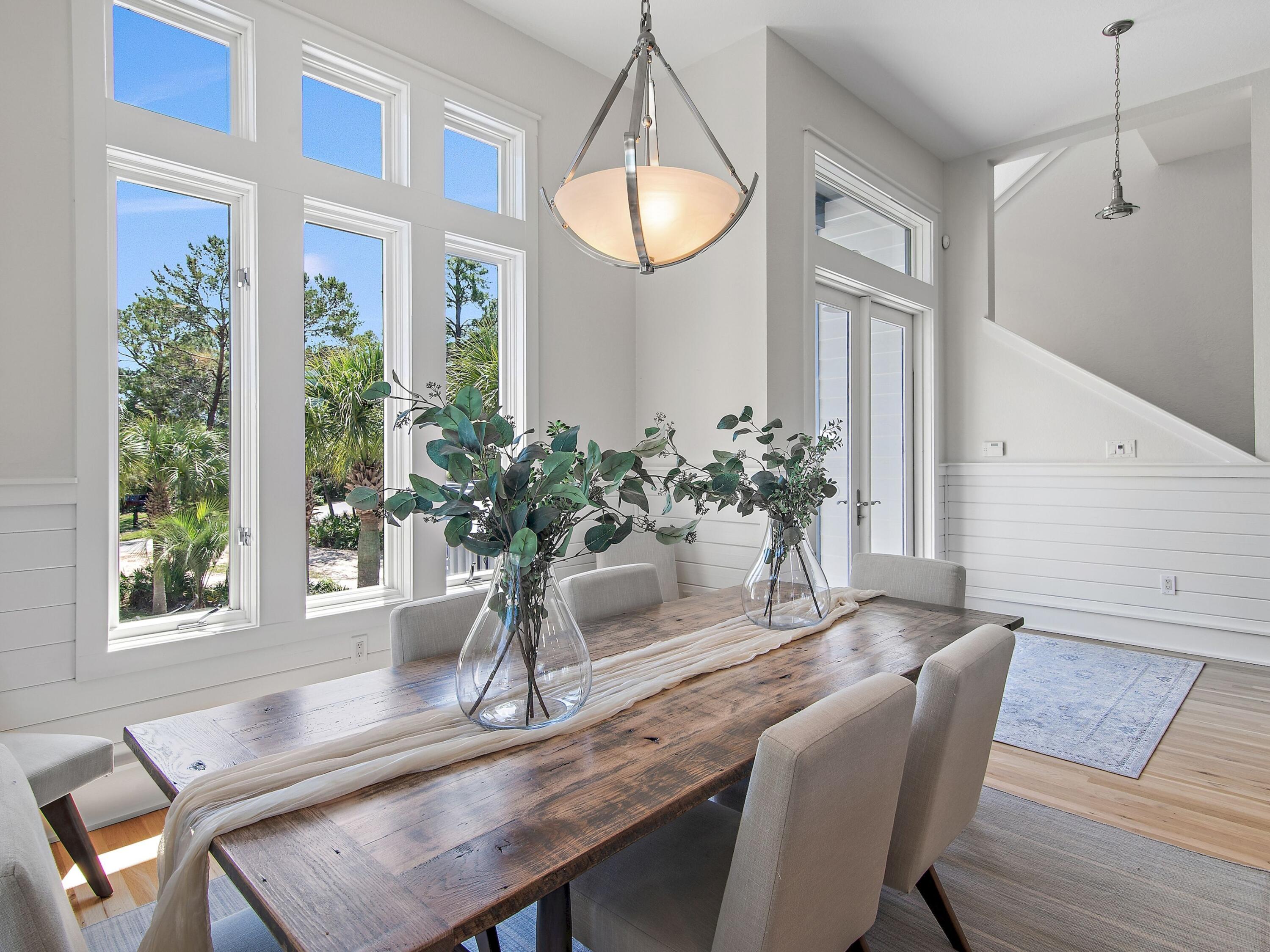 182 My Way Santa Rosa Beach, FL 32459 - Photo 17 of 39 a dining room with furniture and a potted plant