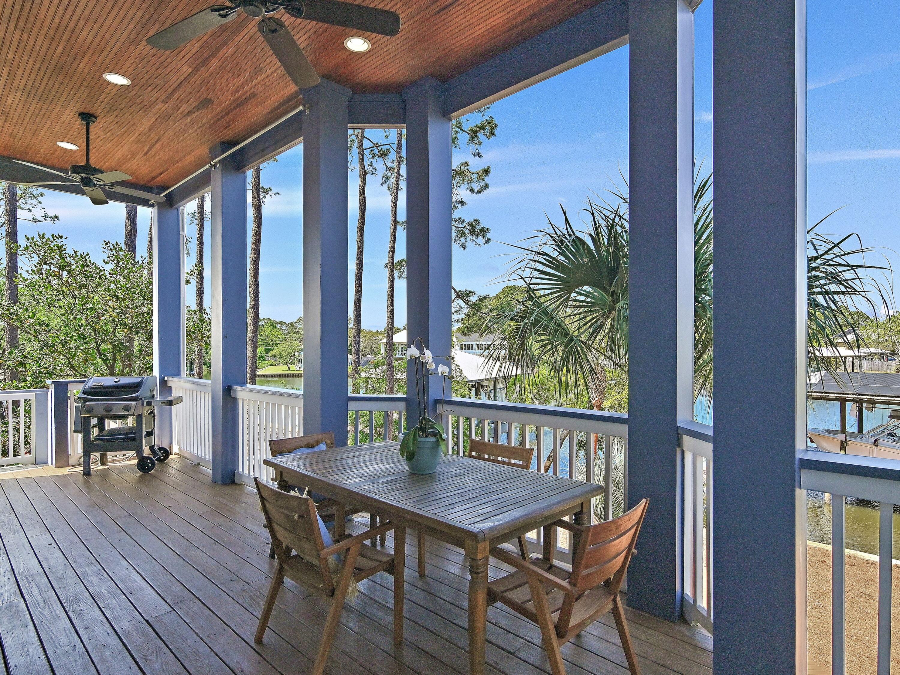 182 My Way Santa Rosa Beach, FL 32459 - Photo 25 of 39 a view of a porch with furniture and wooden floor