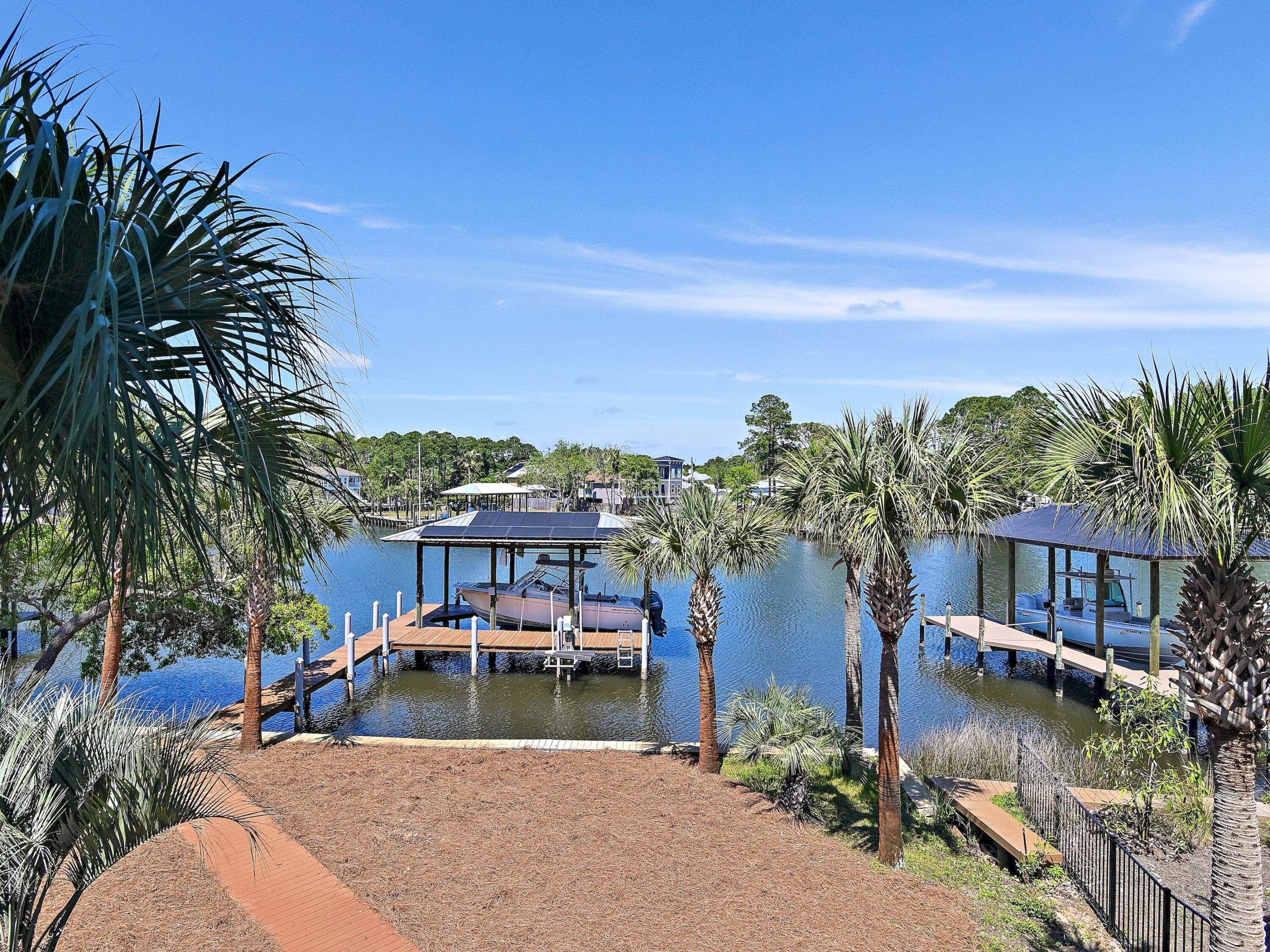 182 My Way Santa Rosa Beach, FL 32459 - Photo 30 of 39 a view of a lake with a house