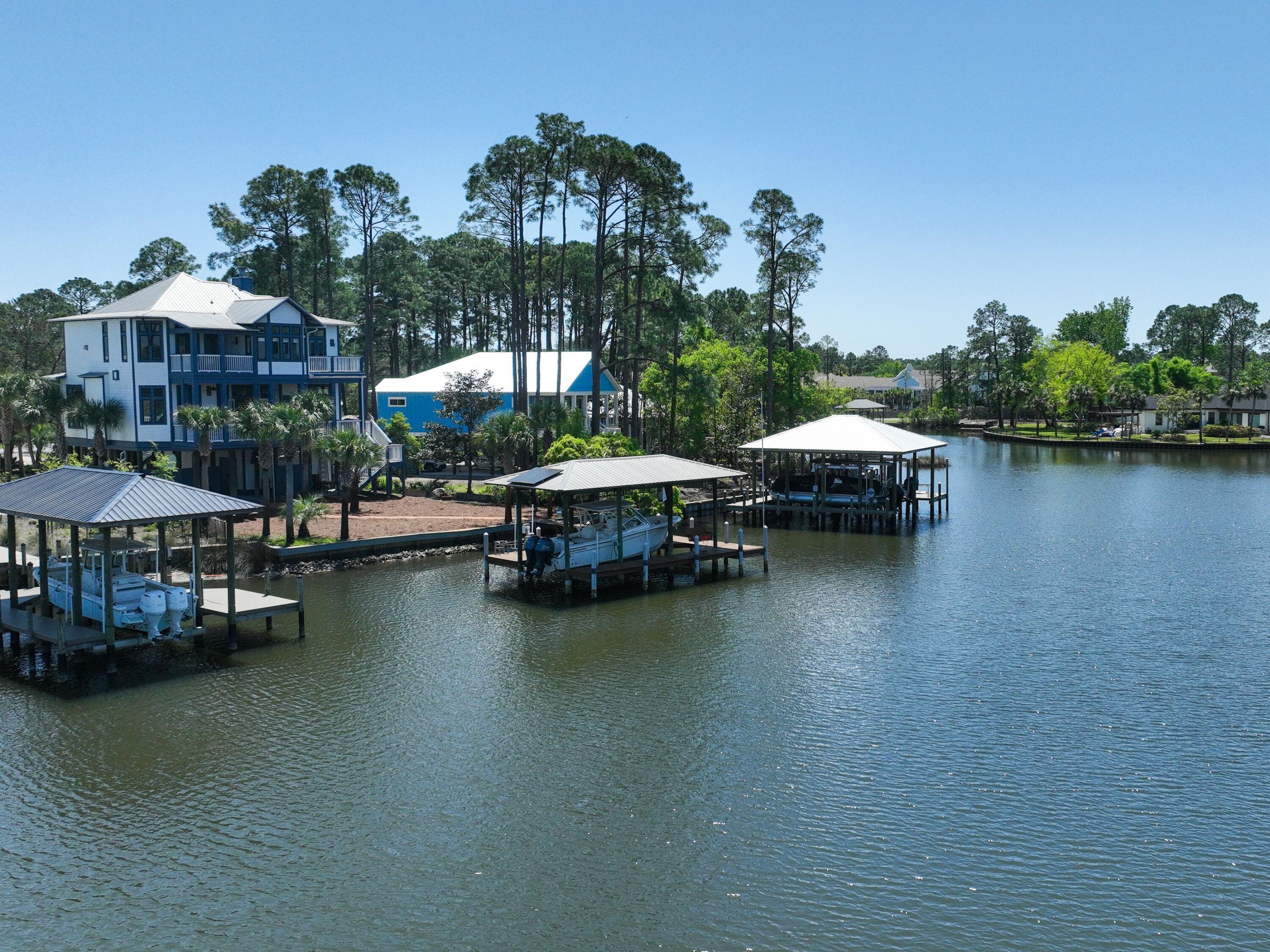 182 My Way Santa Rosa Beach, FL 32459 - Photo 3 of 39 a small pool with lawn chairs under an umbrella
