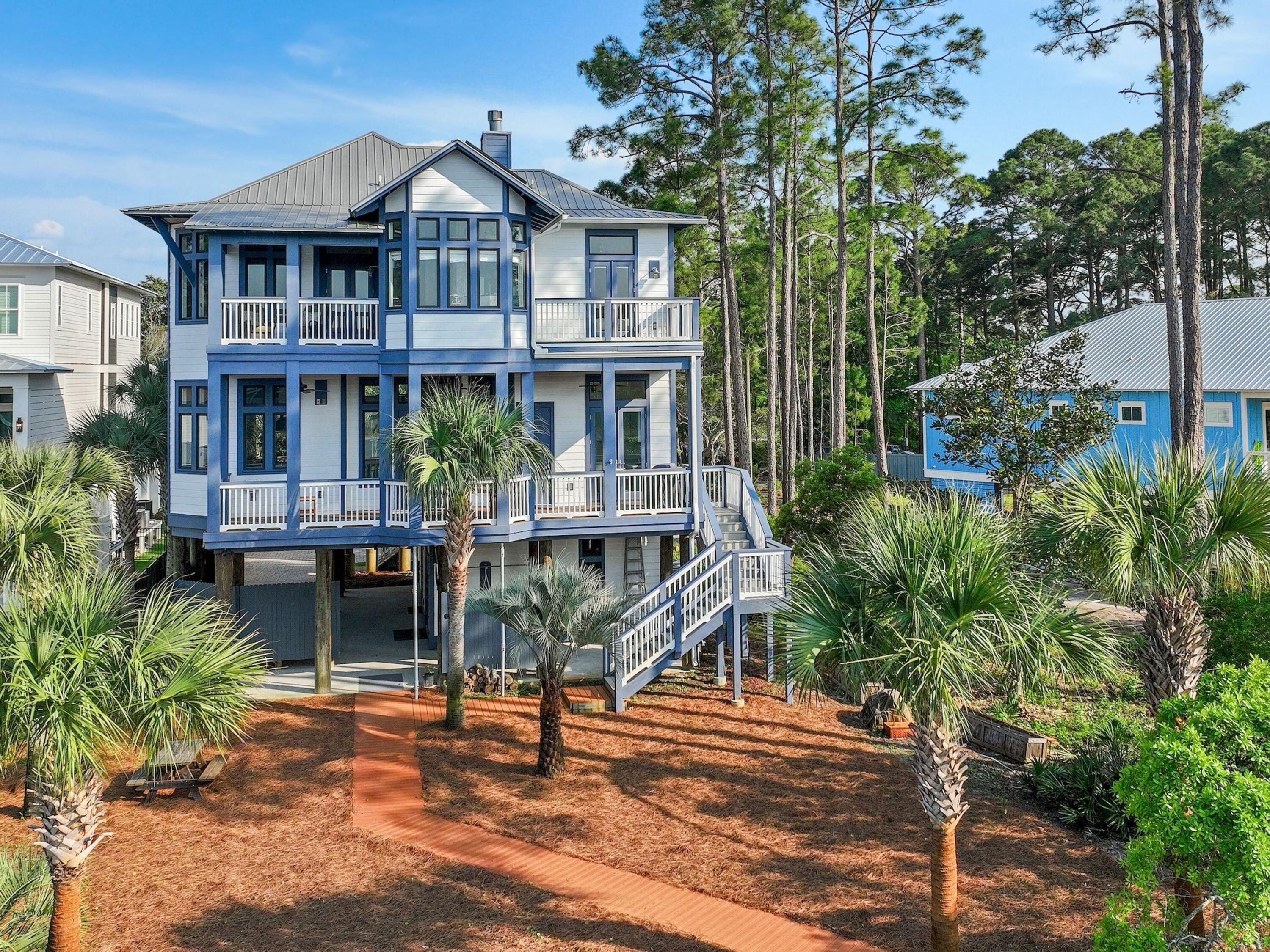 182 My Way Santa Rosa Beach, FL 32459 - Photo 39 of 39 a front view of a house with porch