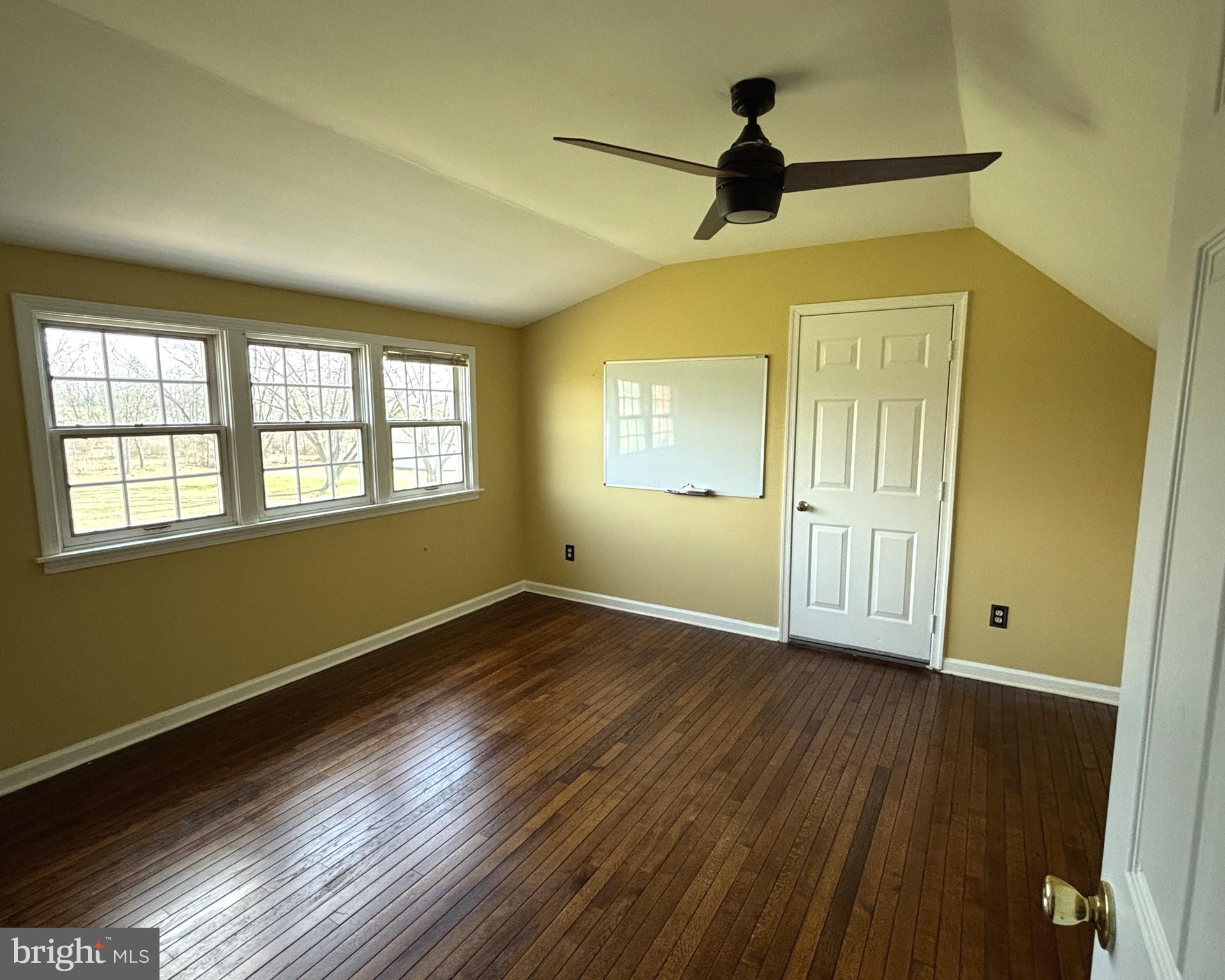 723 Godshall Road Telford, PA 18969 - Photo 18 of 31 a view of an empty room with wooden floor and a window