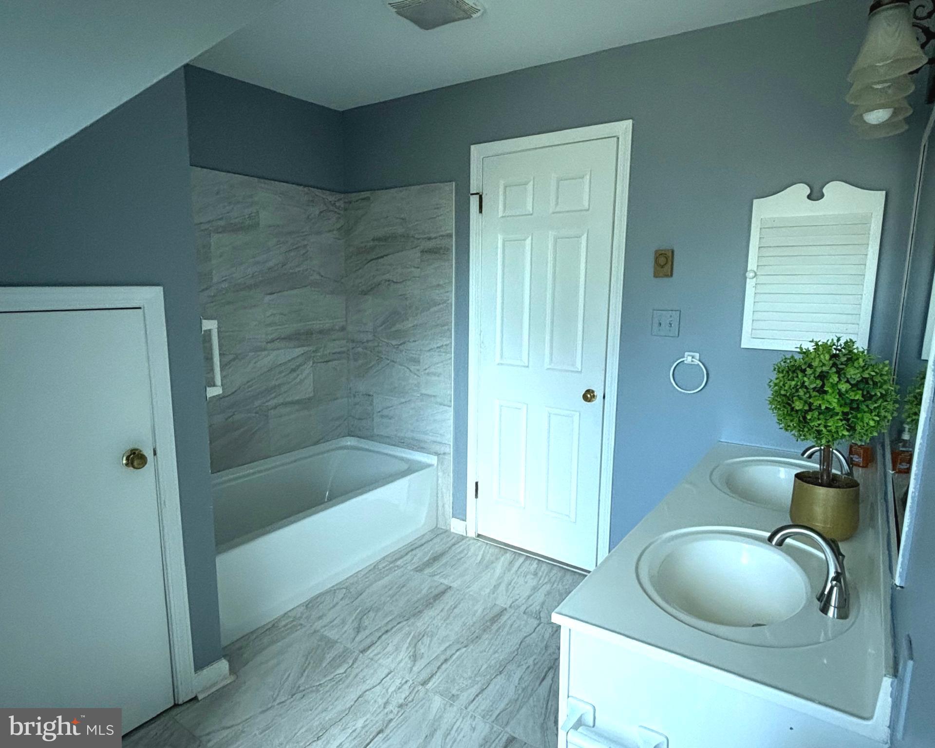 723 Godshall Road Telford, PA 18969 - Photo 20 of 31 a bathroom with a granite countertop sink a toilet and bathtub