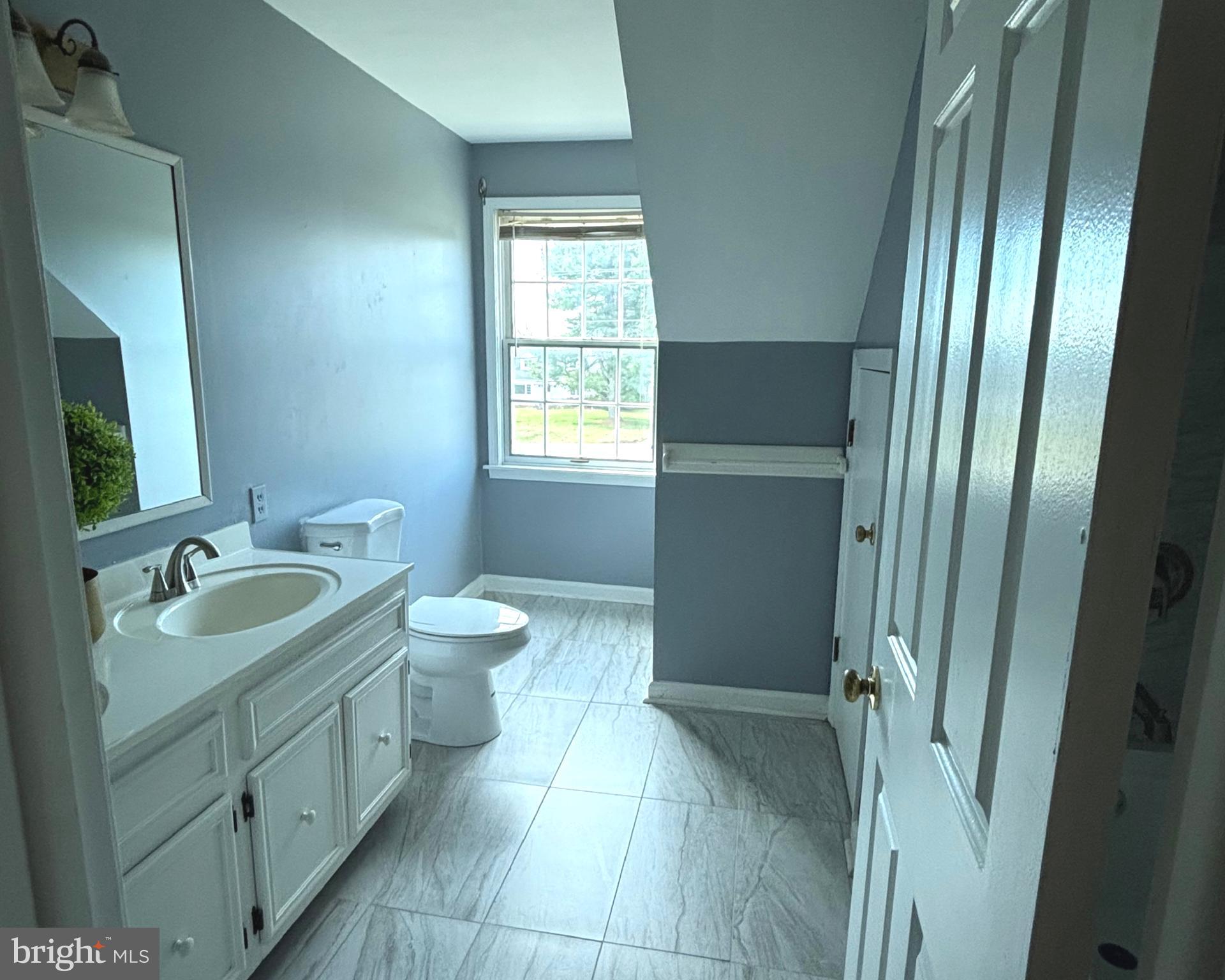 723 Godshall Road Telford, PA 18969 - Photo 21 of 31 a spacious bathroom with a double vanity sink toilet mirror and window