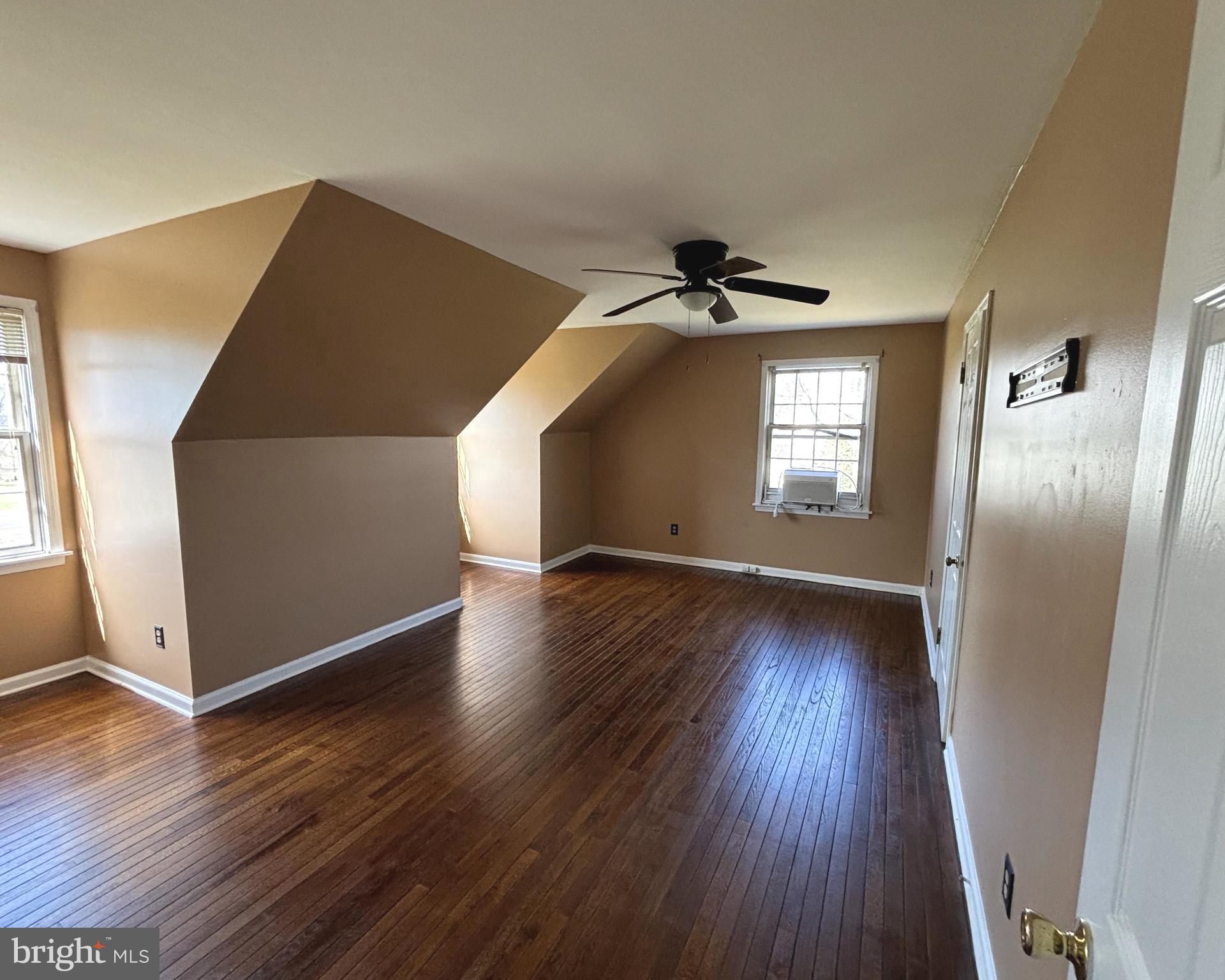 723 Godshall Road Telford, PA 18969 - Photo 26 of 31 a view of an empty room with wooden floor and a window