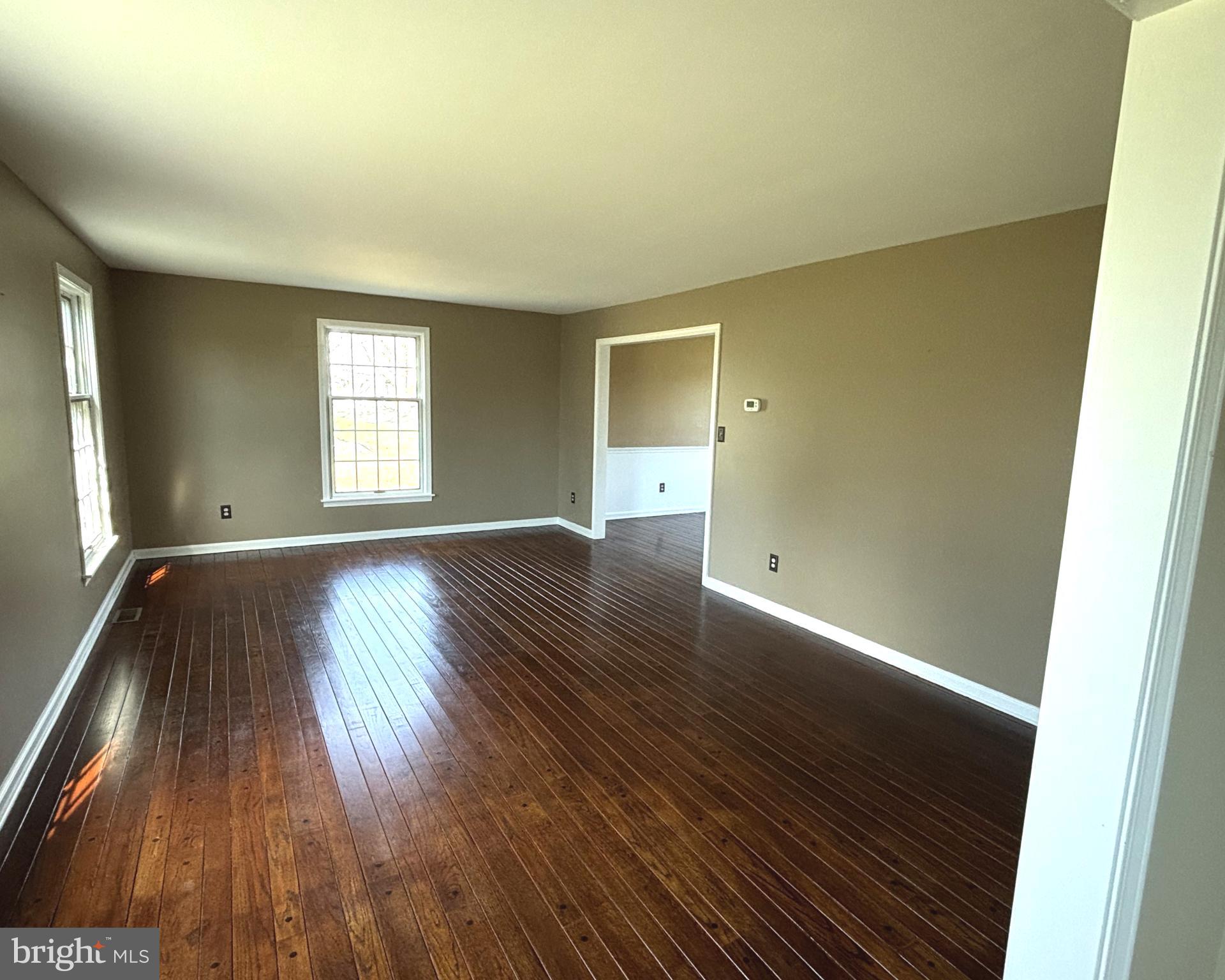 723 Godshall Road Telford, PA 18969 - Photo 8 of 31 an empty room with wooden floor and windows