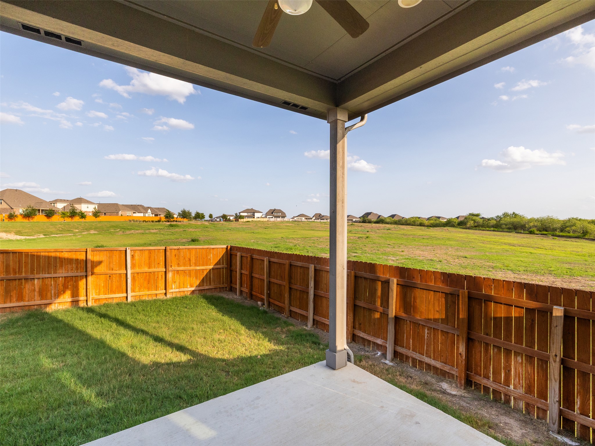 606 Spinnaker Loop Kyle, TX 78640 - Photo 32 of 37 A spacious backyard with a private fence offers ample room for outdoor activities and future landscaping endeavors.