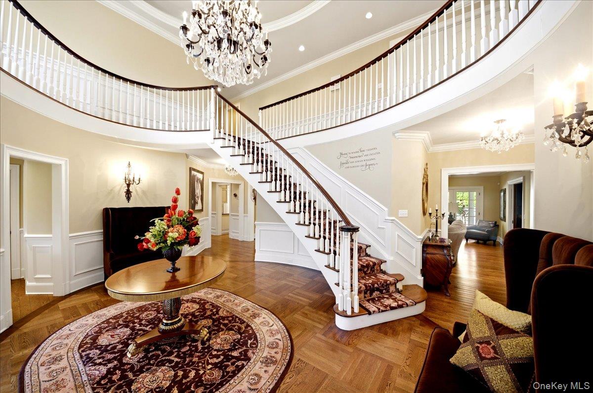 7 Ridgeview Circle Armonk, NY 10504 - Photo 18 of 50 a living room with furniture and a chandelier