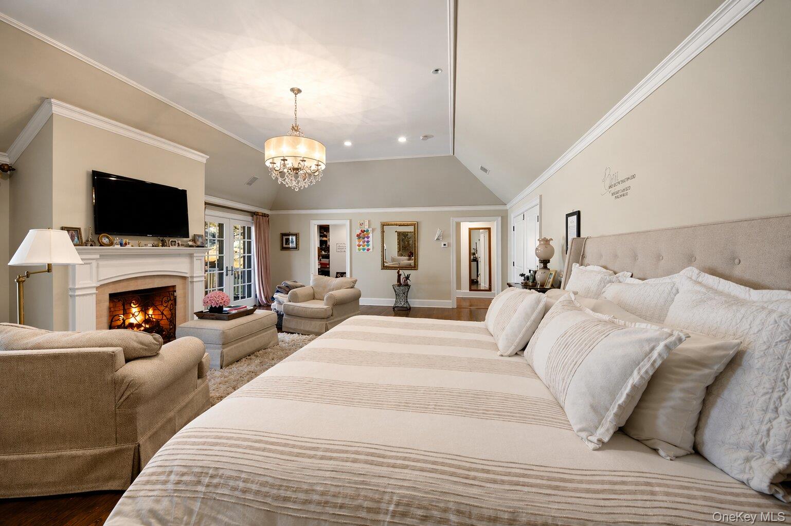 7 Ridgeview Circle Armonk, NY 10504 - Photo 21 of 50 a spacious bedroom with a bed and a fireplace