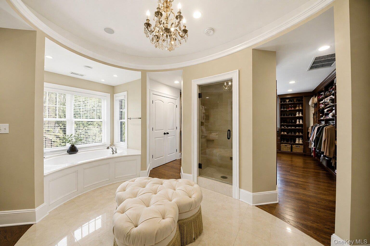 7 Ridgeview Circle Armonk, NY 10504 - Photo 23 of 50 a spacious bathroom with a glass shower door and a window