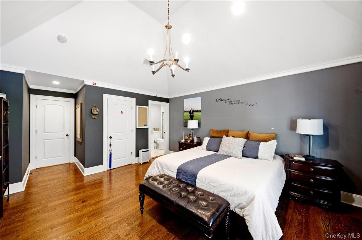 7 Ridgeview Circle Armonk, NY 10504 - Photo 25 of 50 a bedroom with a bed and wooden floor