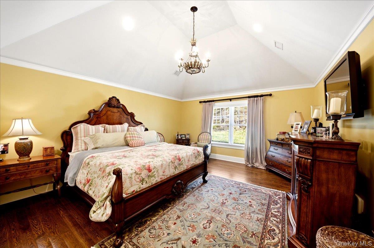 7 Ridgeview Circle Armonk, NY 10504 - Photo 30 of 50 a bedroom with a bed and wooden floor
