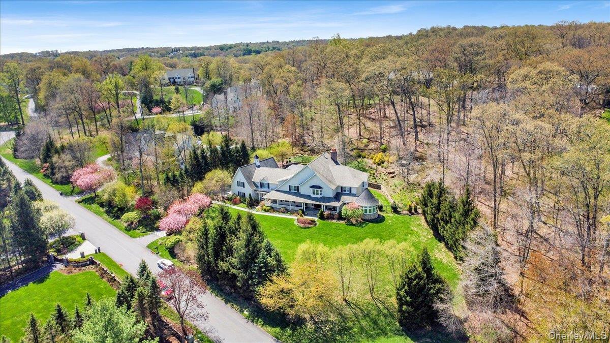 7 Ridgeview Circle Armonk, NY 10504 - Photo 3 of 50 a view of a house with a garden and mountains