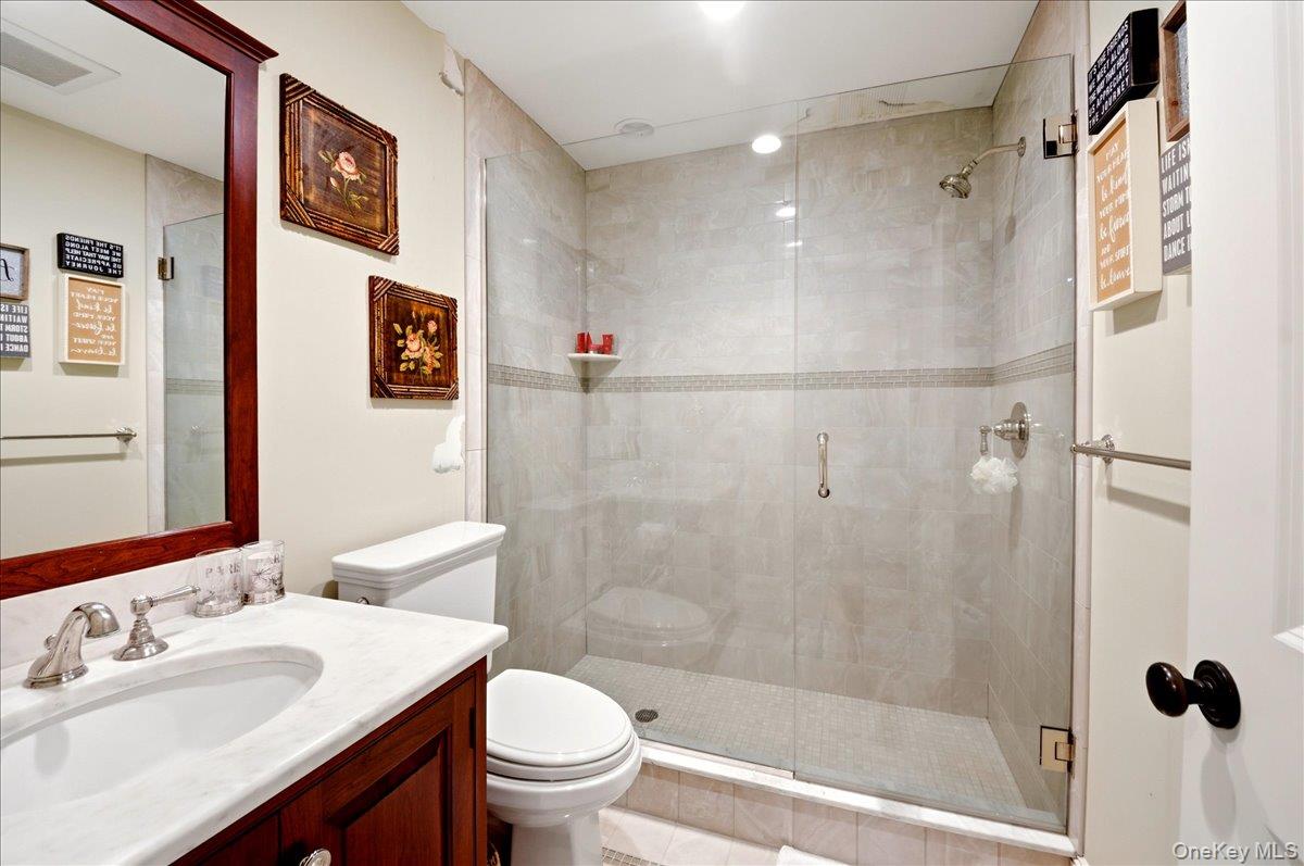 7 Ridgeview Circle Armonk, NY 10504 - Photo 31 of 50 a bathroom with a sink mirror toilet and shower