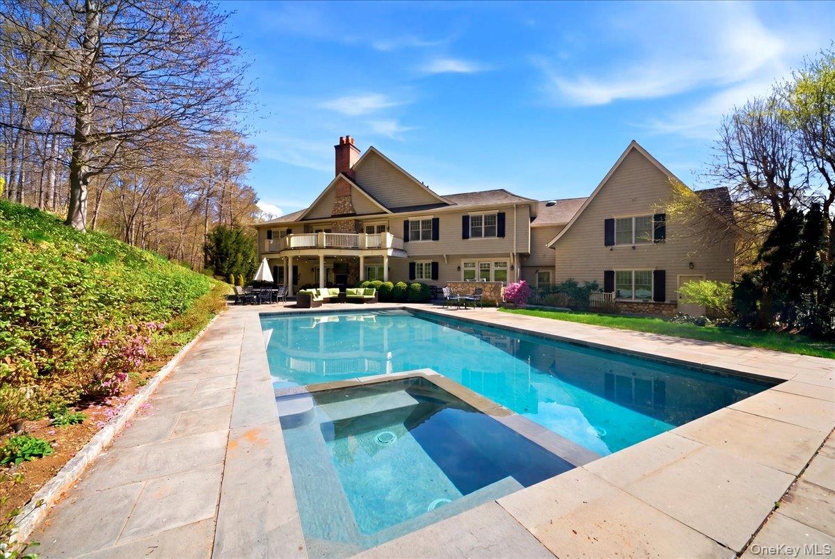 7 Ridgeview Circle Armonk, NY 10504 - Photo 43 of 50 a view of house with swimming pool next to a yard