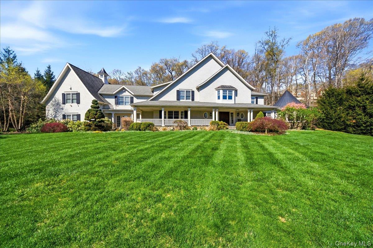 7 Ridgeview Circle Armonk, NY 10504 - Photo 46 of 50 a front view of a house with a yard