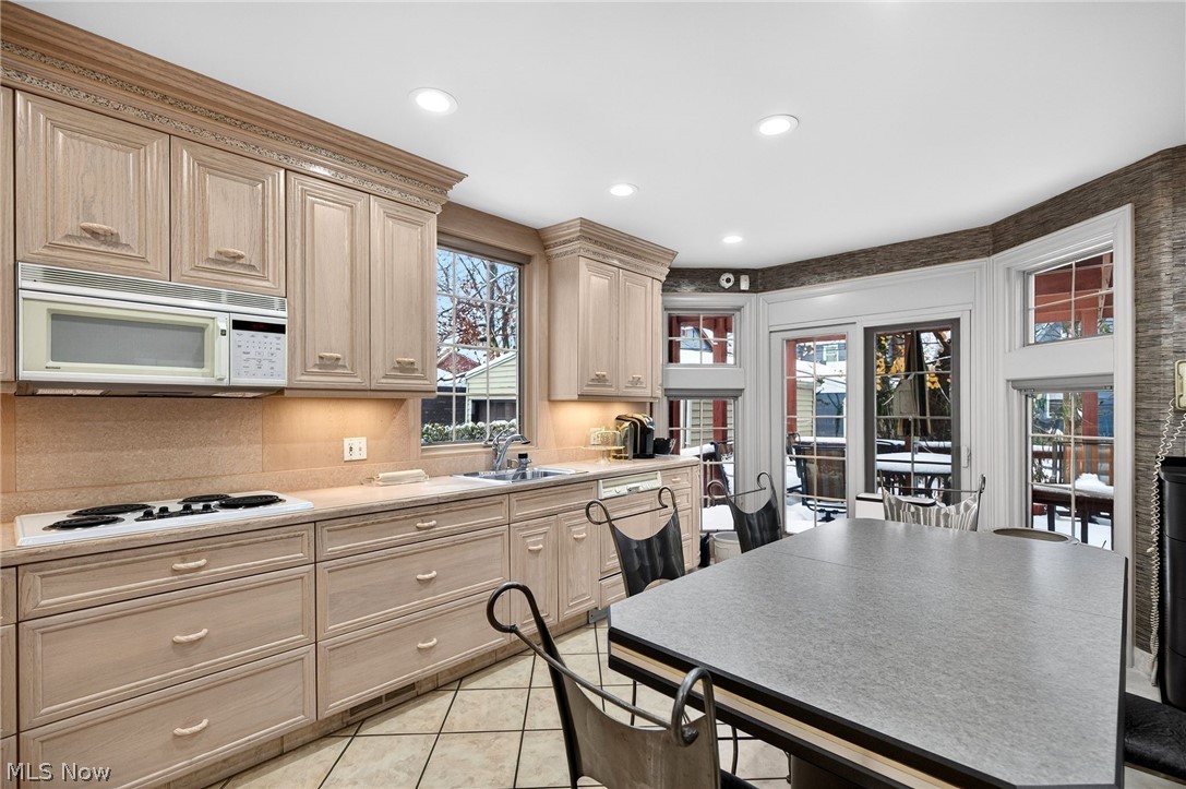 3498 Bainbridge Road Cleveland Heights, OH 44118 - Photo 17 of 50 Kitchen featuring light countertops, white appliances, light tile patterned floors, recessed lighting, and light brown cabinets