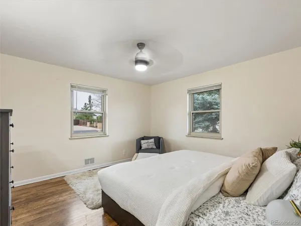 a bedroom with a bed and chair