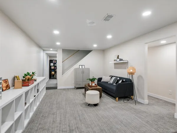 a room with furniture and a wooden floor