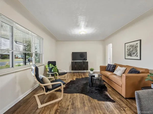 a view of a dining room with furniture and a rug