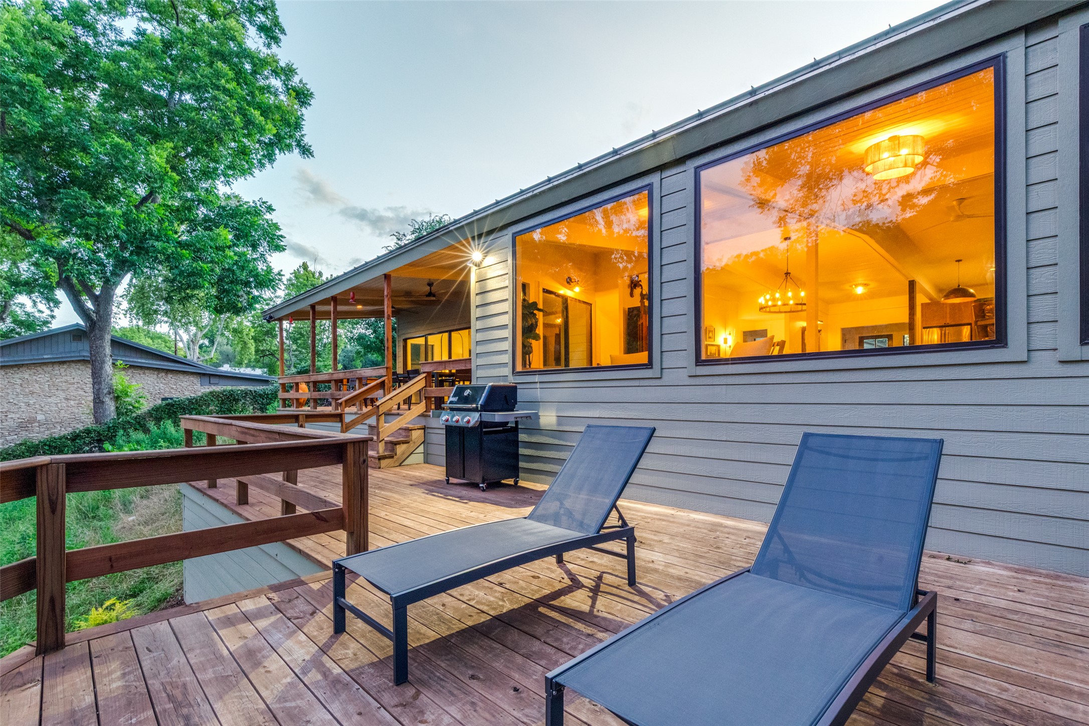 303 Lago Verde Road Austin, TX 78734 - Photo 30 of 39 A spacious wooden deck provides ample room for outdoor enjoyment and relaxation.