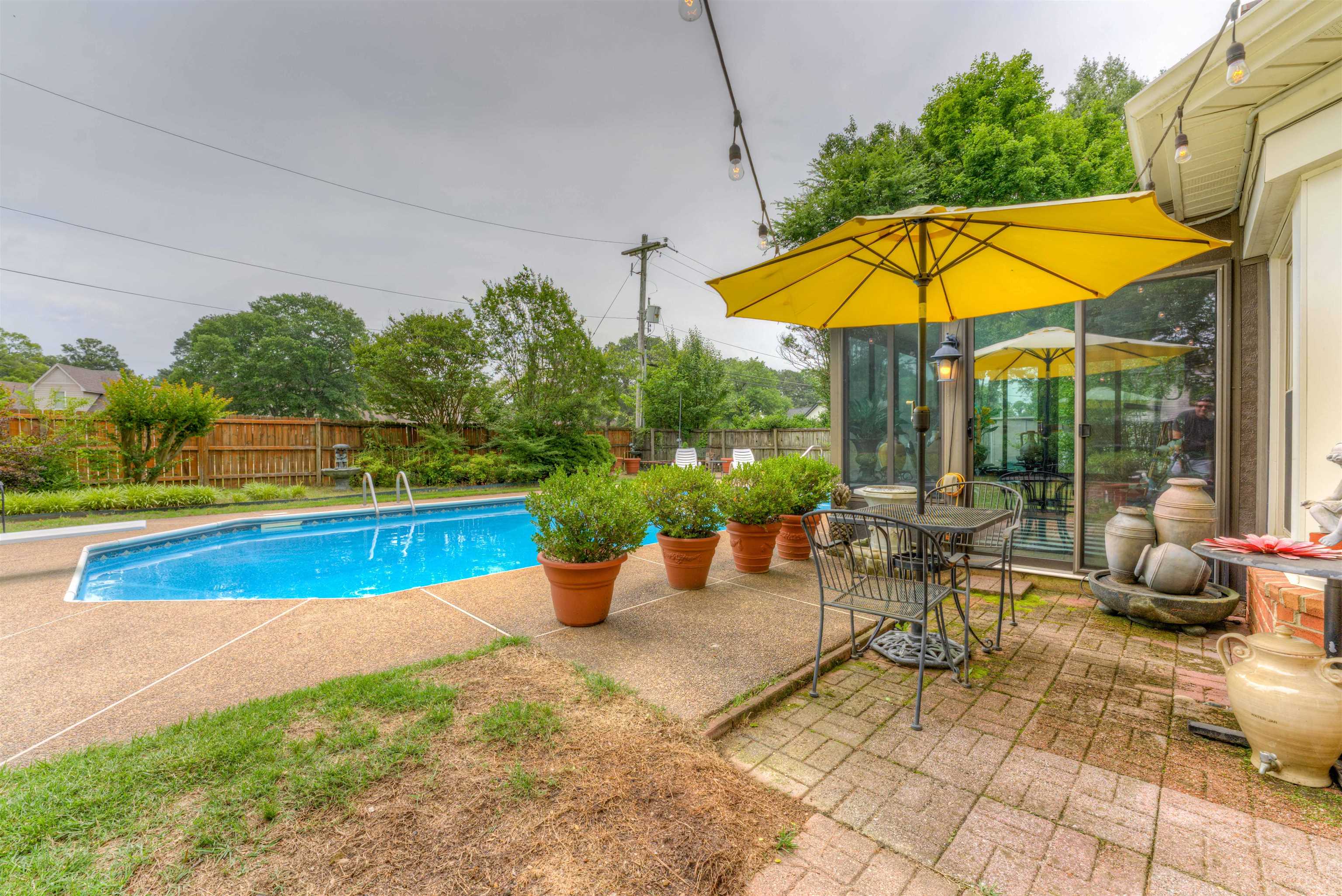 3930 Bobby Jones Road Memphis, TN 38125 - Photo 12 of 35 a view of backyard with swimming pool and table