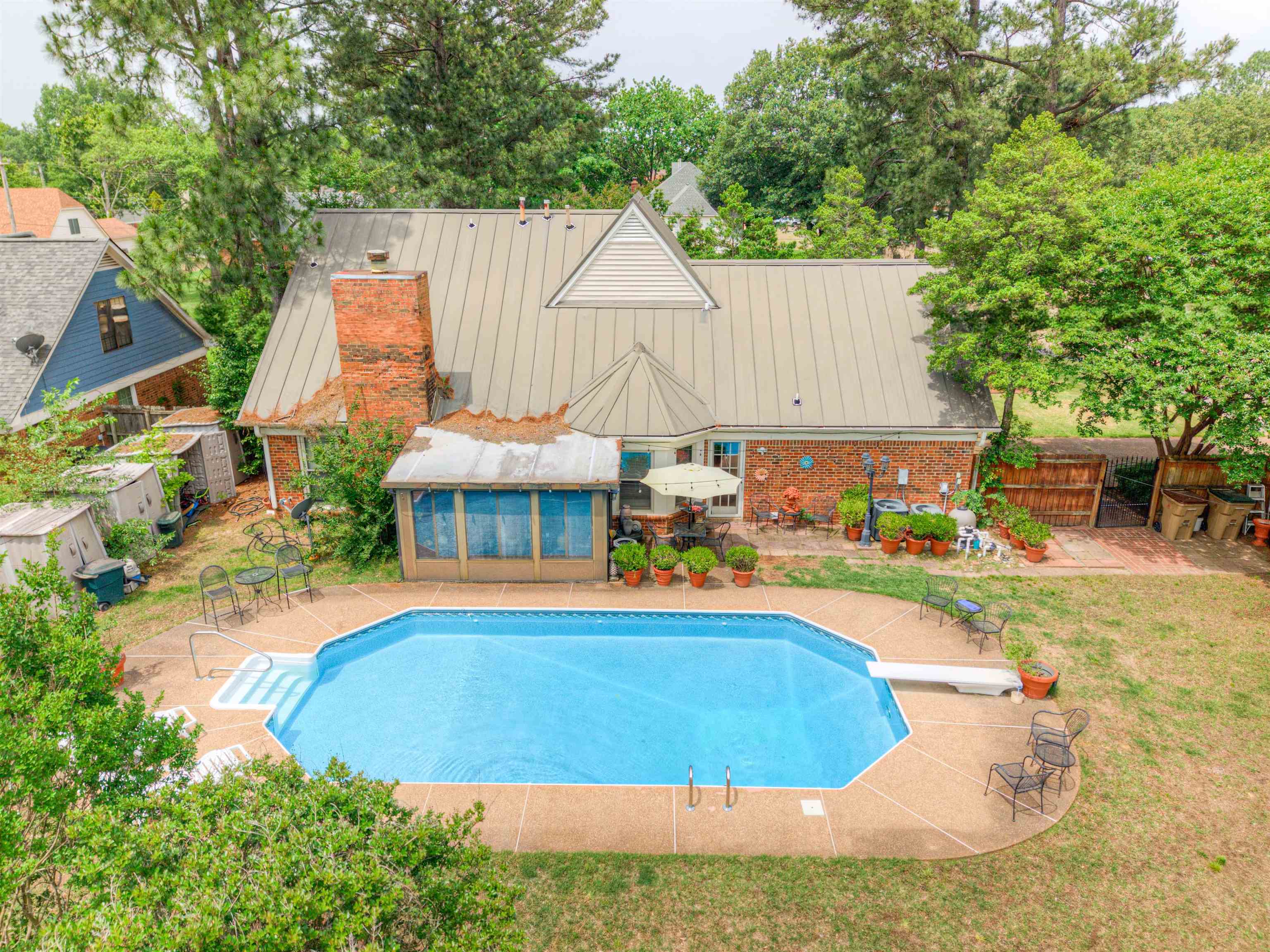 3930 Bobby Jones Road Memphis, TN 38125 - Photo 13 of 35 a view of a house with swimming pool and sitting area