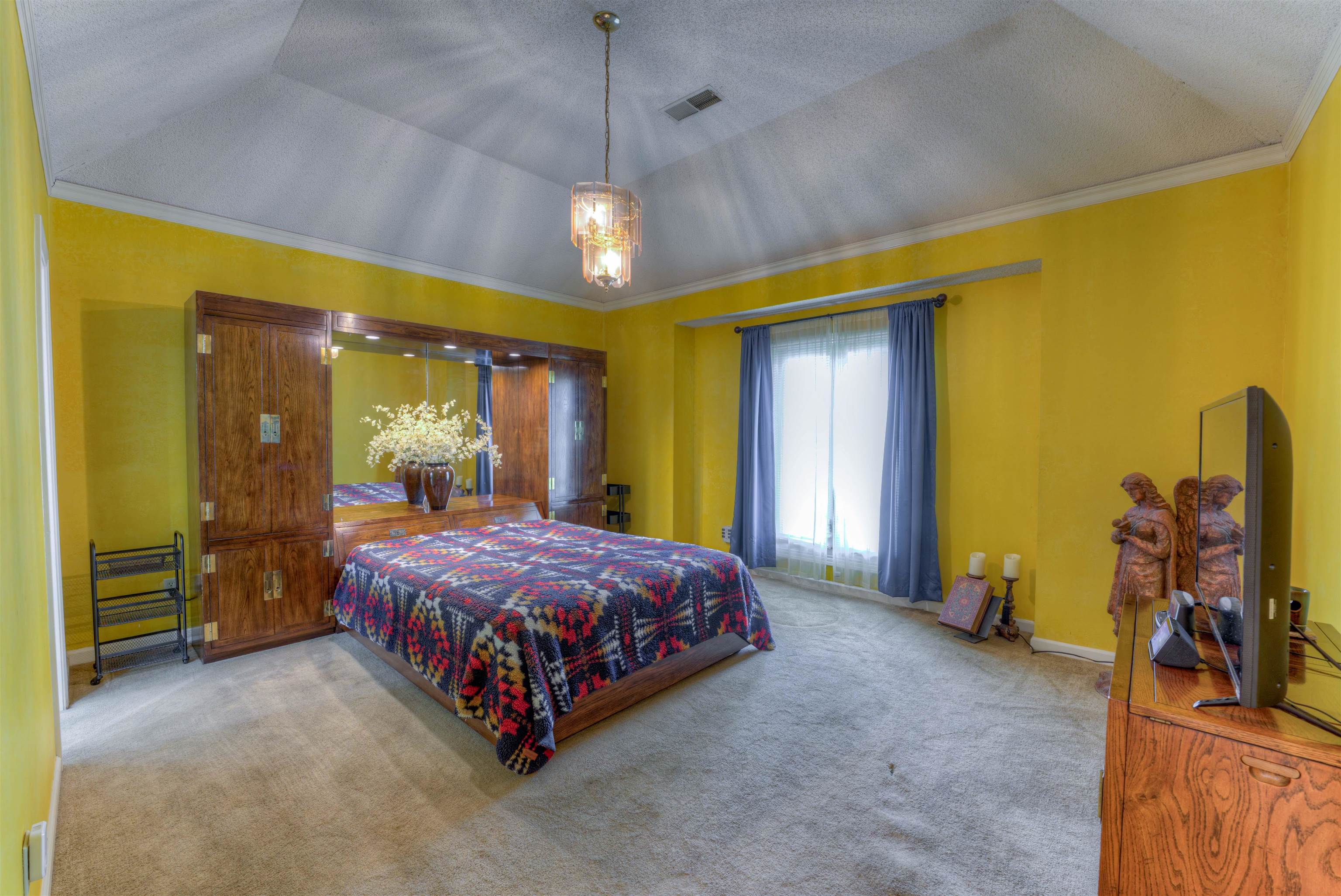 3930 Bobby Jones Road Memphis, TN 38125 - Photo 15 of 35 a bed sitting in a room next to a window