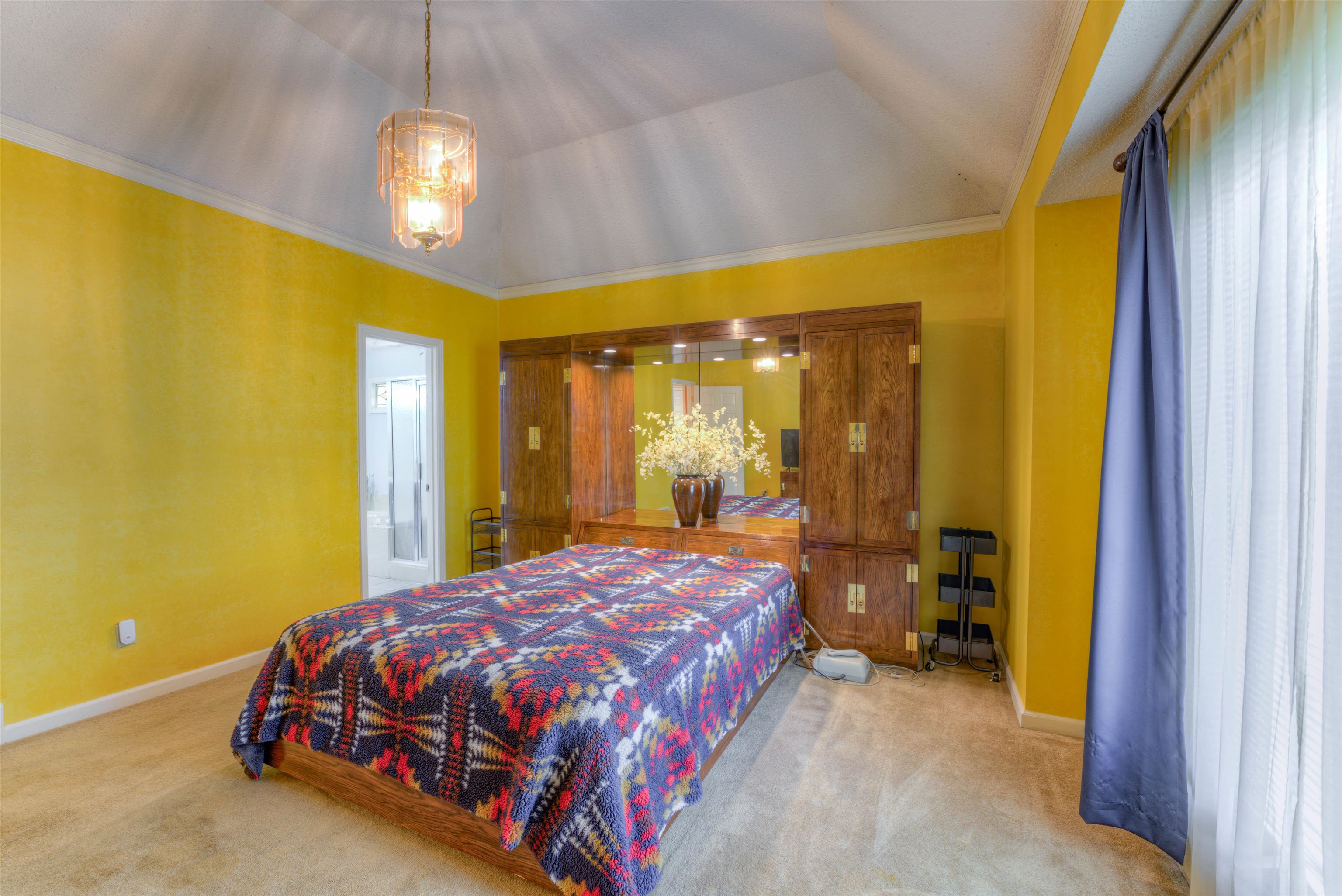 3930 Bobby Jones Road Memphis, TN 38125 - Photo 16 of 35 a bedroom with a bed and dresser with mirror