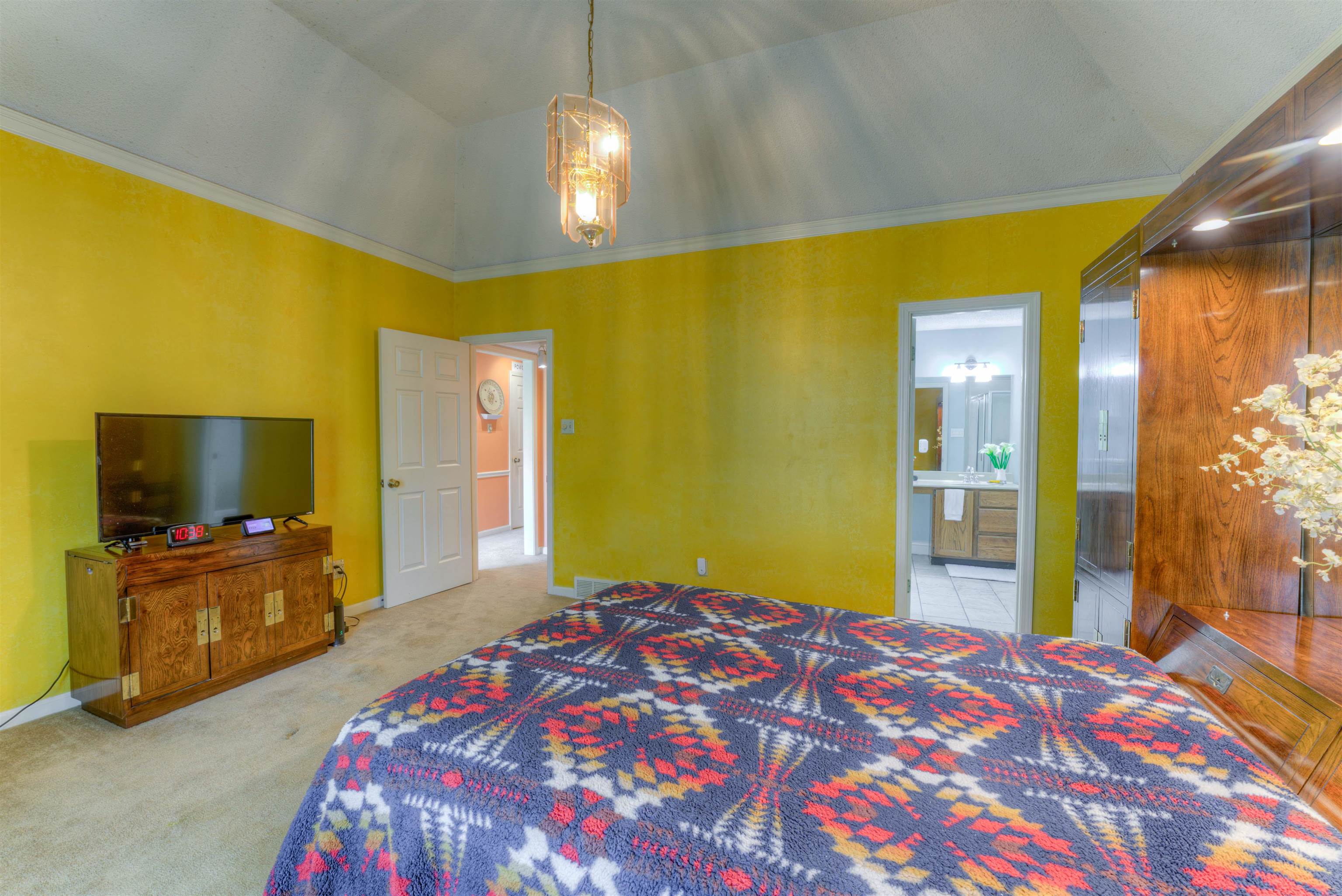 3930 Bobby Jones Road Memphis, TN 38125 - Photo 17 of 35 a bedroom with a bed and a flat screen tv