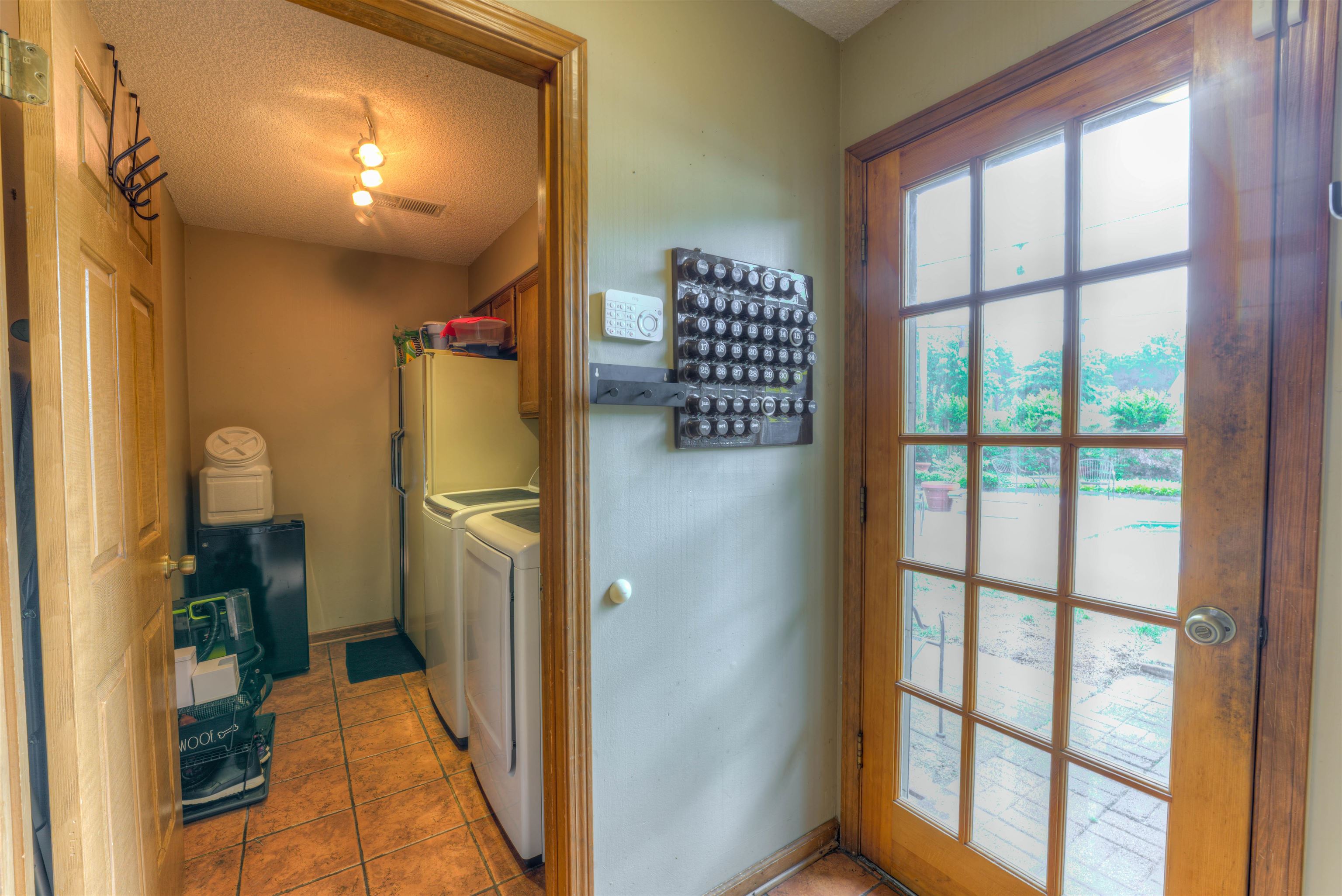 3930 Bobby Jones Road Memphis, TN 38125 - Photo 21 of 35 a view of a hallway with wooden shelves