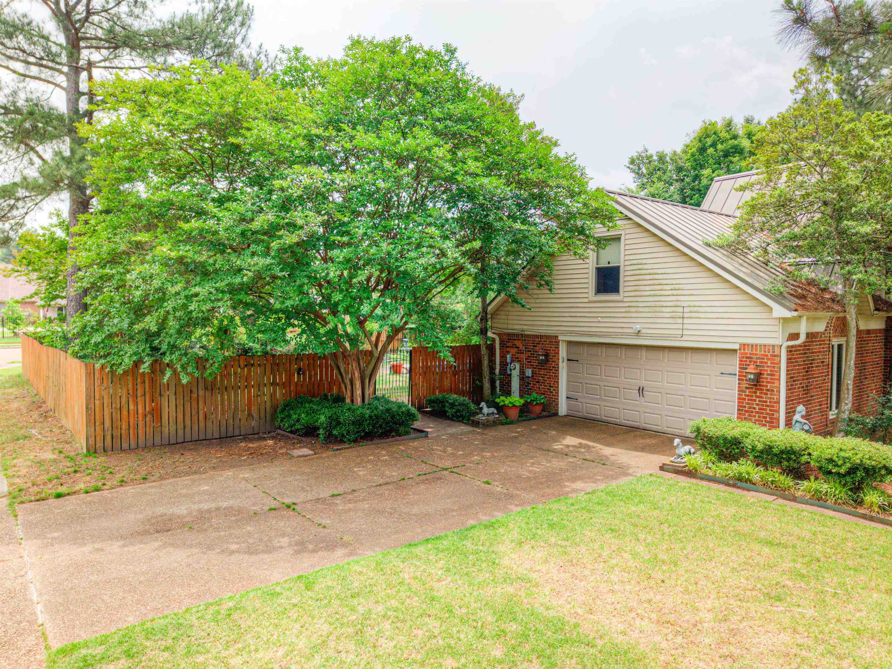 3930 Bobby Jones Road Memphis, TN 38125 - Photo 28 of 35 a view of a yard with a house and a large tree