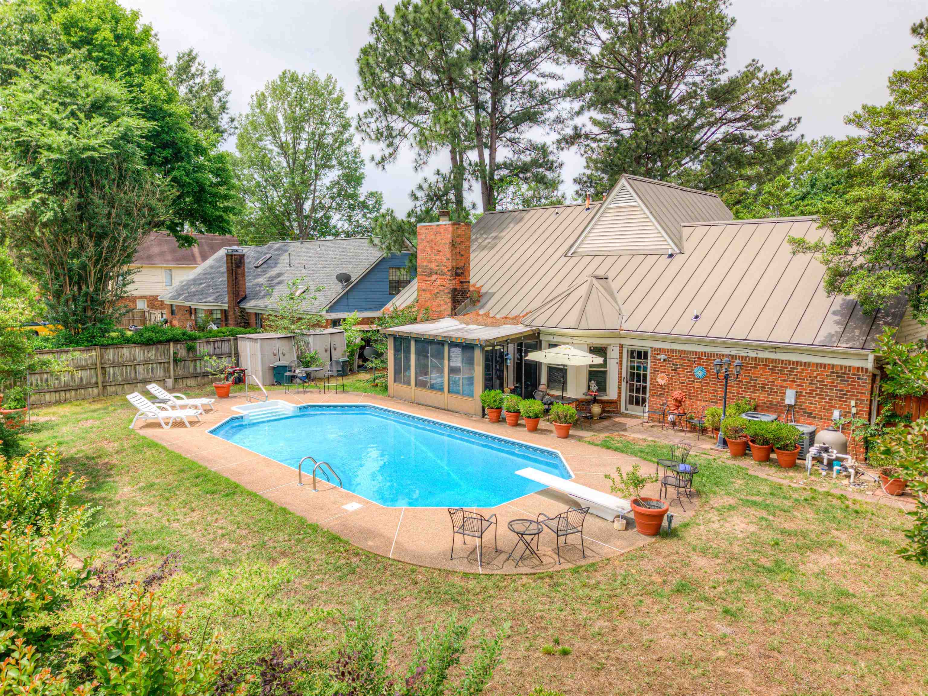 3930 Bobby Jones Road Memphis, TN 38125 - Photo 34 of 35 a view of a house with swimming pool and sitting area