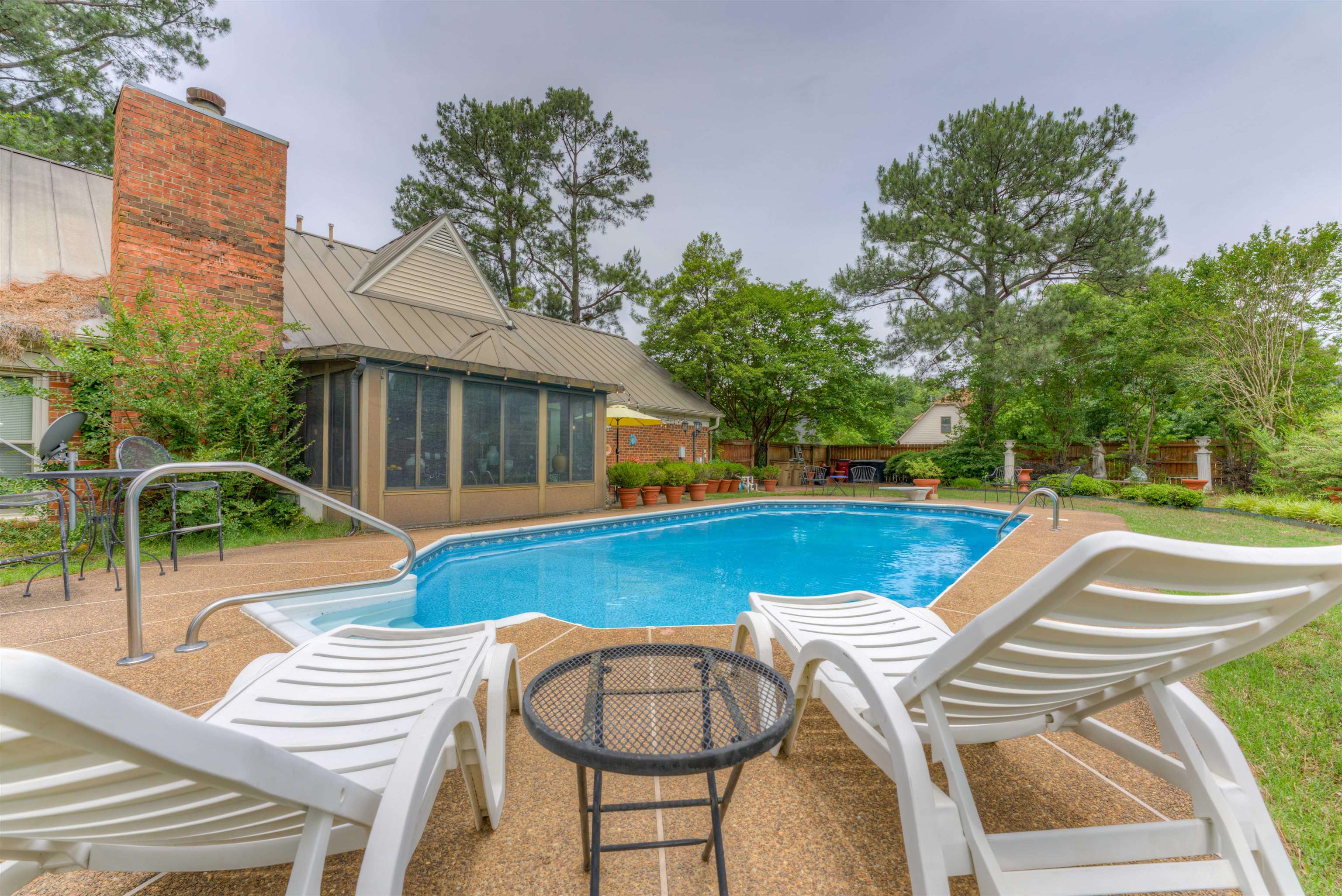 3930 Bobby Jones Road Memphis, TN 38125 - Photo 35 of 35 a view of a house with swimming pool and sitting area