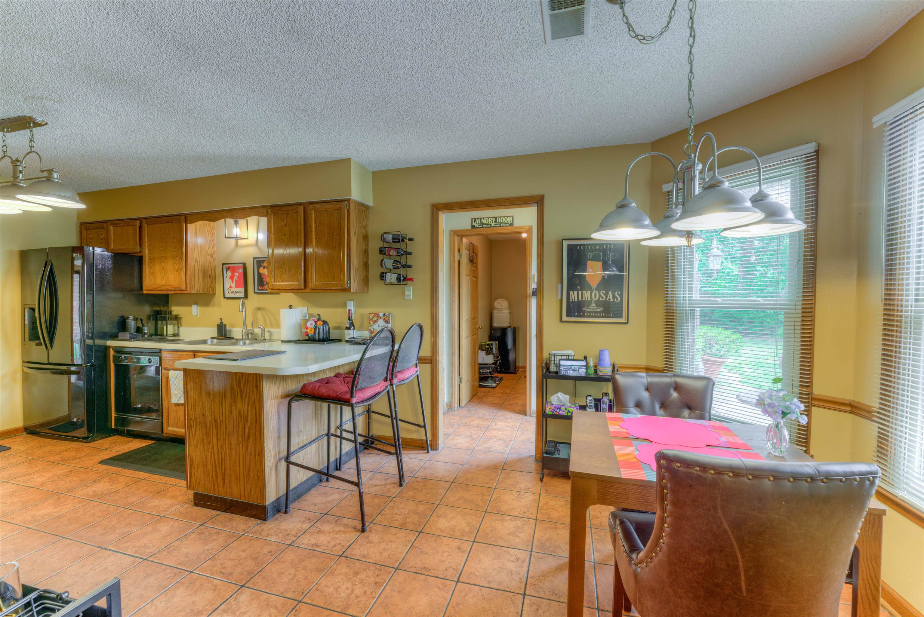 3930 Bobby Jones Road Memphis, TN 38125 - Photo 7 of 35 a room with dining table and chairs