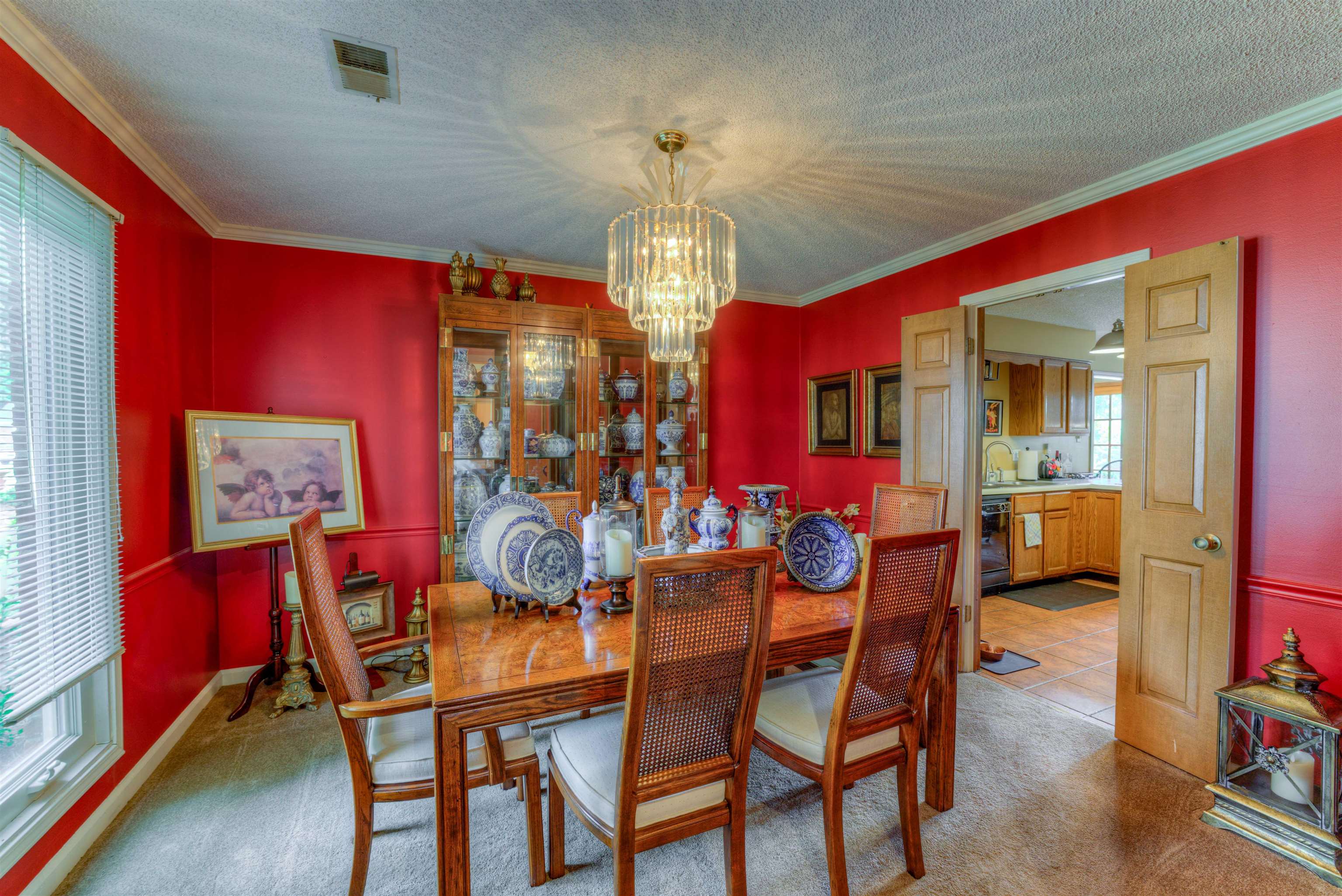 3930 Bobby Jones Road Memphis, TN 38125 - Photo 9 of 35 a view of a dining room with furniture and chandelier